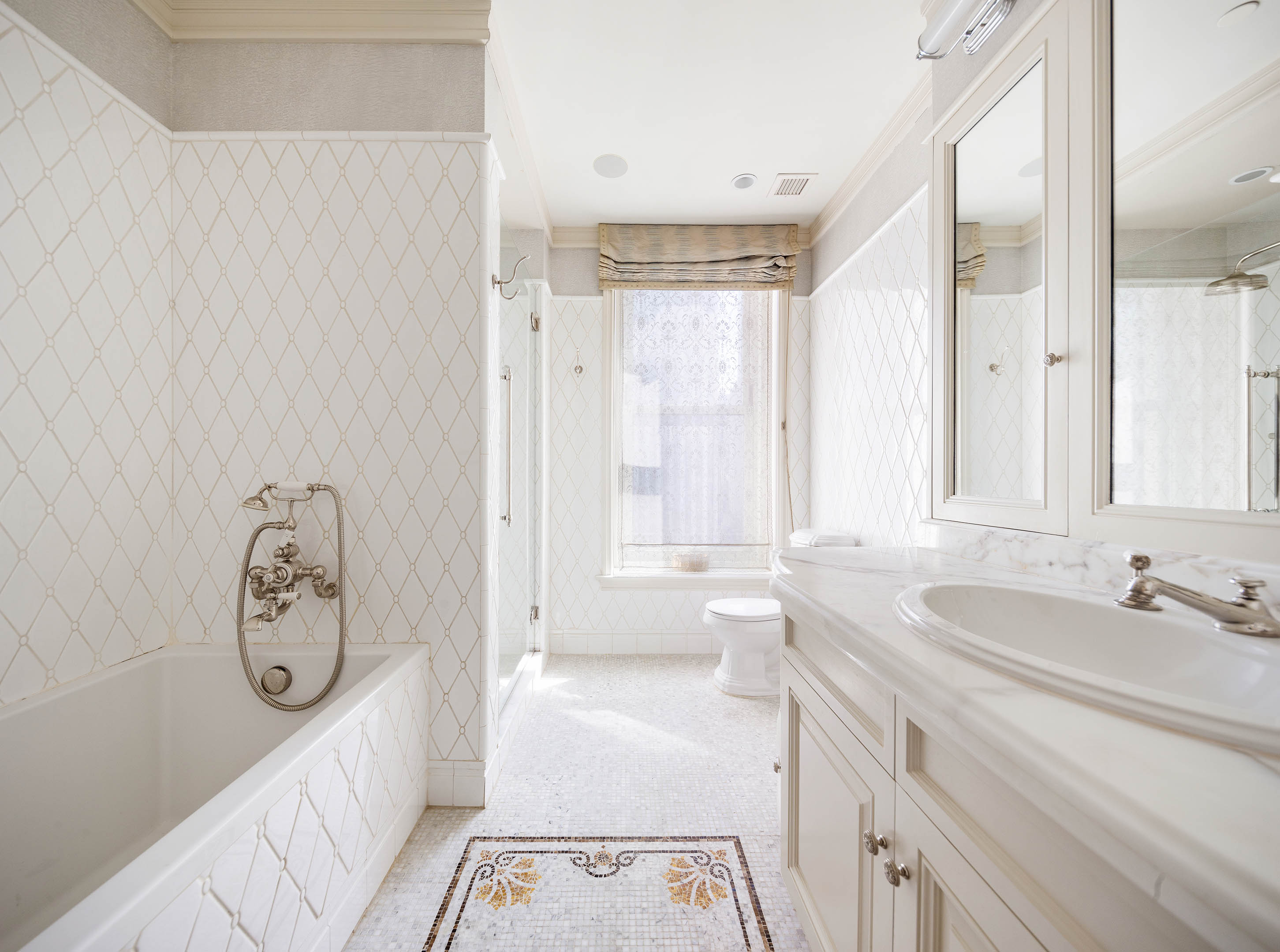 1 Central Park South, Unit 1309 Manhattan, NY 10019 - Photo 11 of 26 a spacious bathroom with a tub sink and mirror