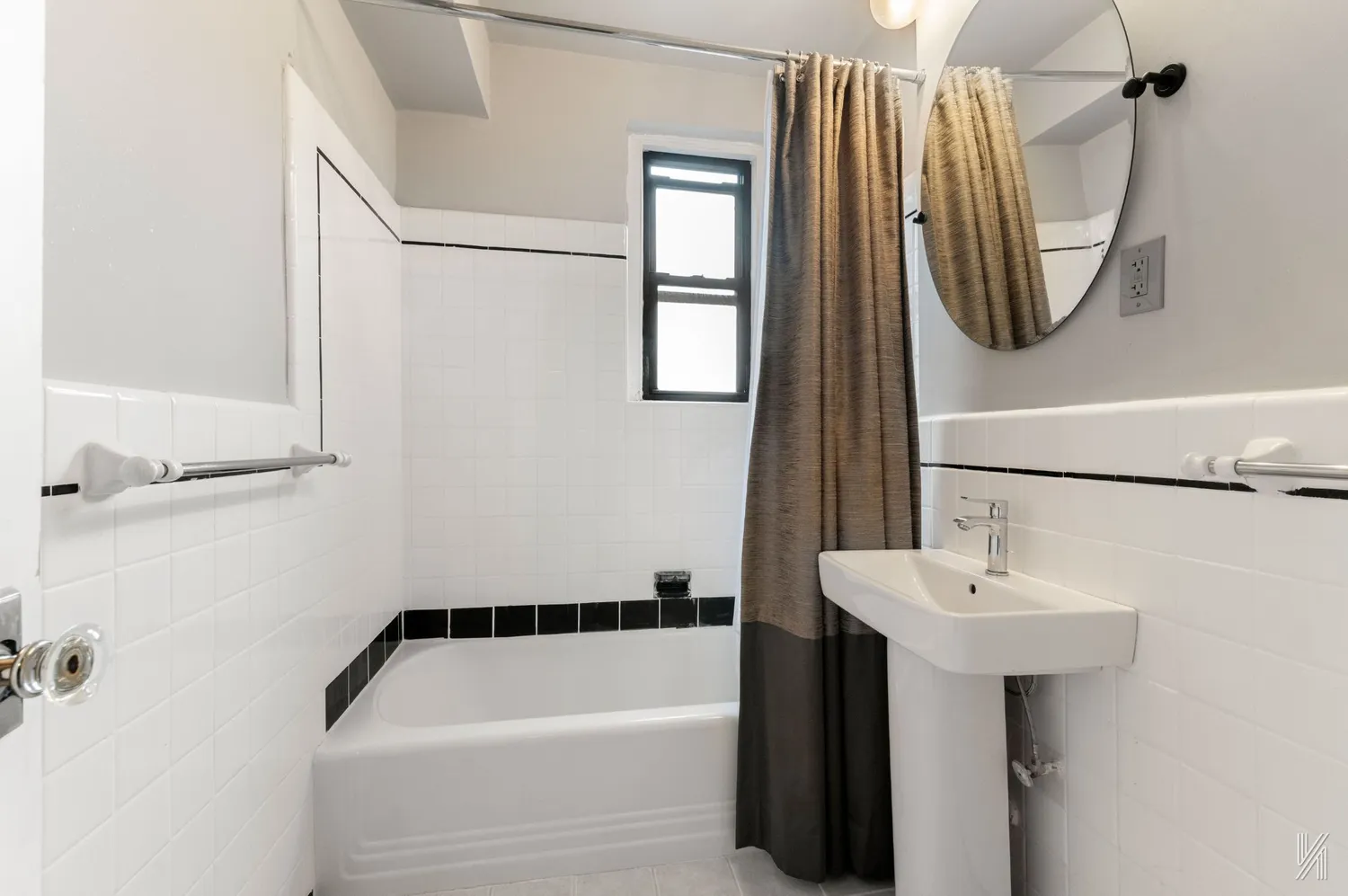 a bathroom with a sink a mirror and a bathtub