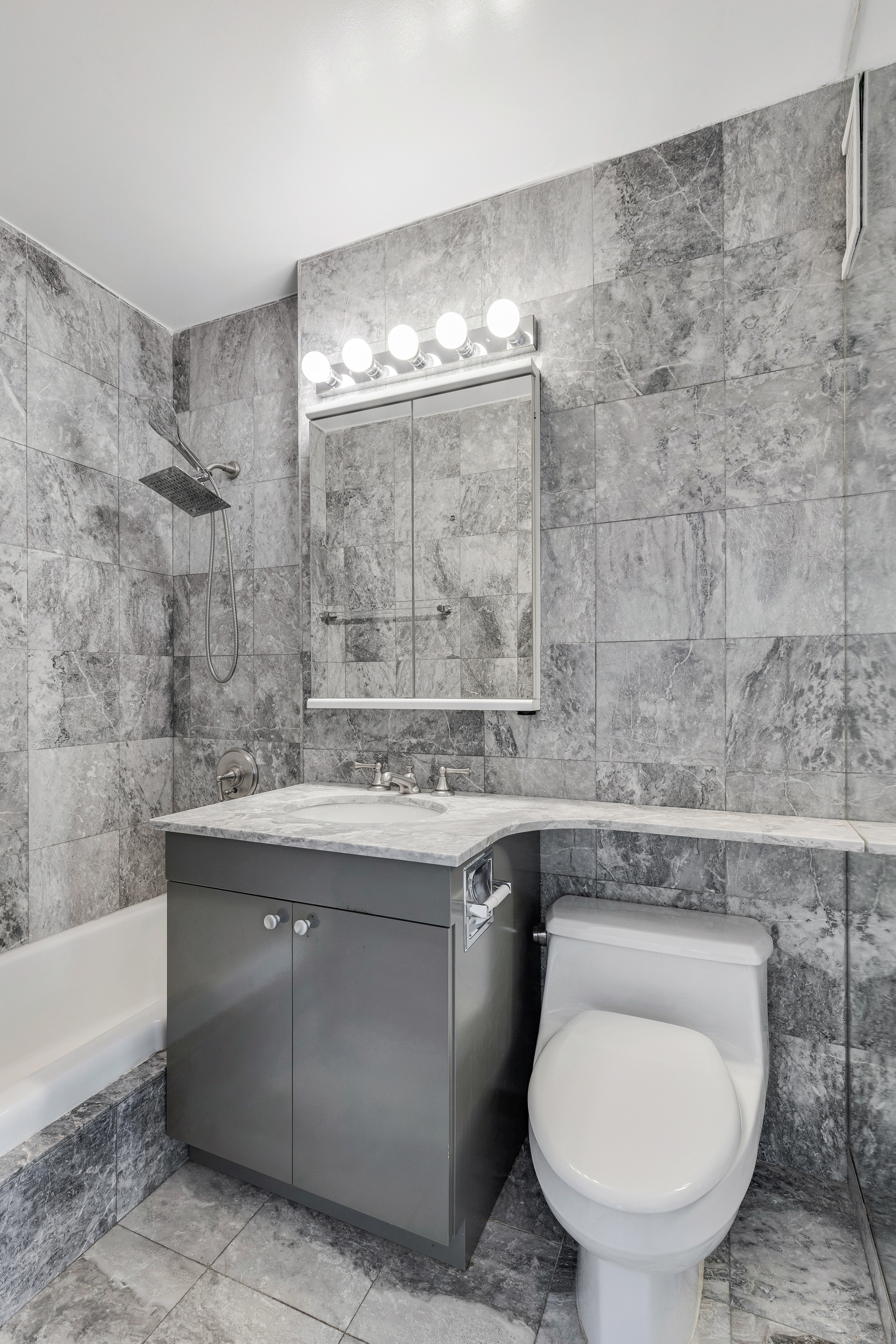 2025 Broadway, Unit 7AB Manhattan, NY 10023 - Photo 6 of 13 a bathroom with a sink and mirror