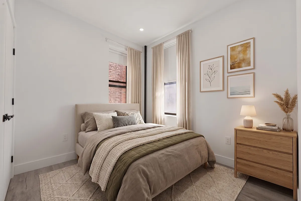 301 East 90th Street, Unit 4C Manhattan, NY 10128 - Photo 4 of 11 a bedroom with a bed and a cabinets