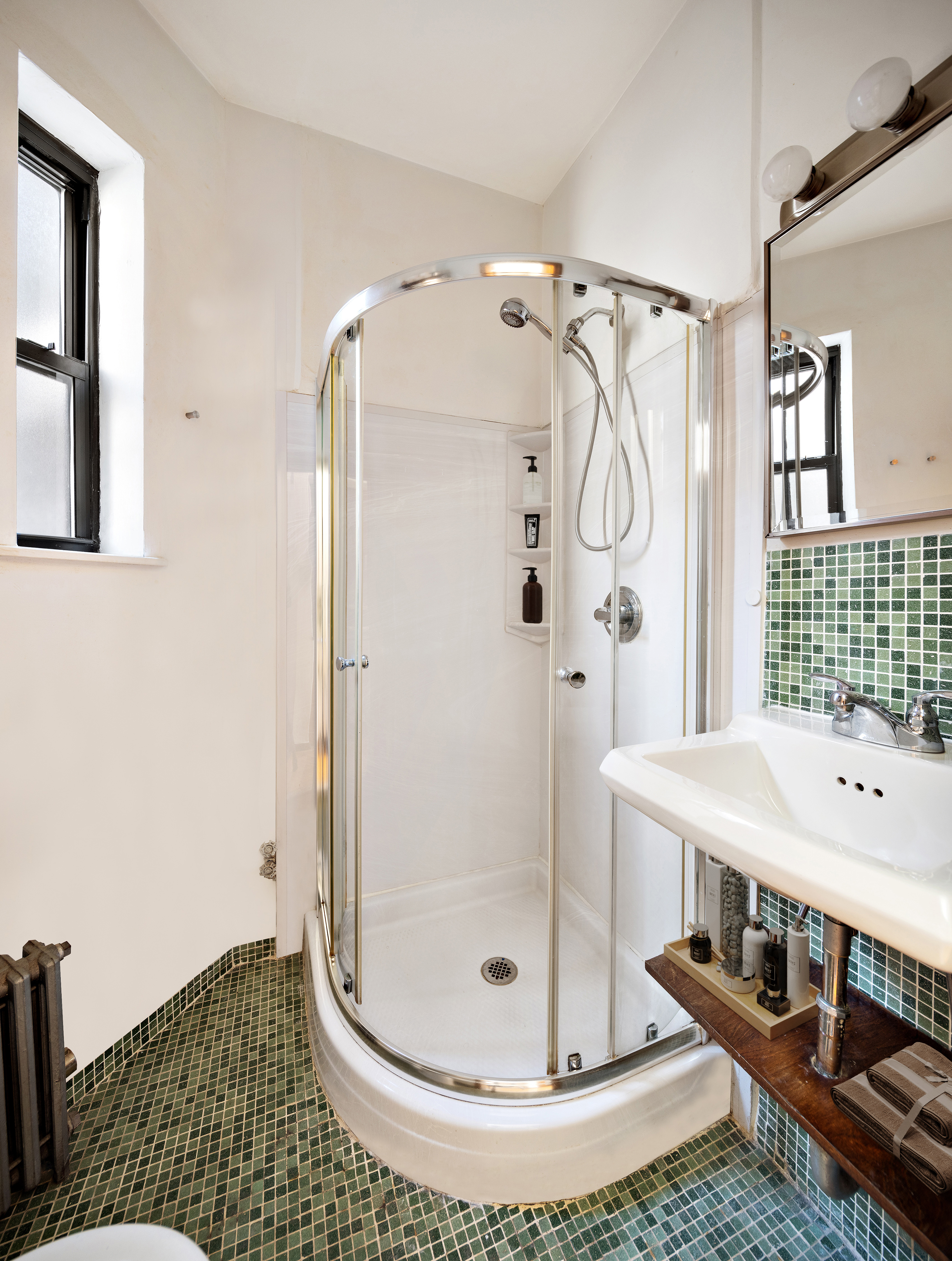 438 West 49th Street, Unit 5B Manhattan, NY 10019 - Photo 6 of 7 a bathroom with a shower