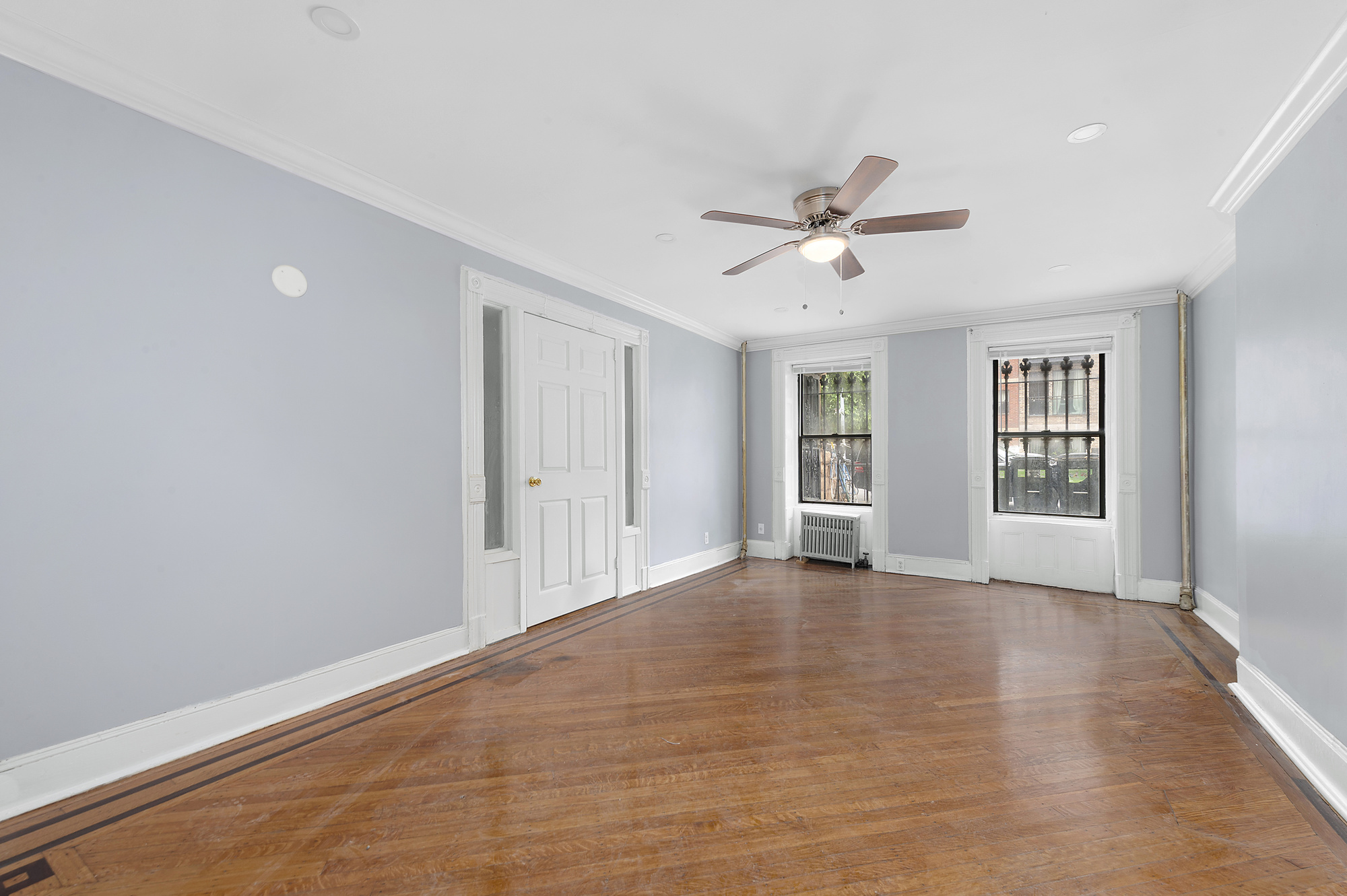 194 Pulaski Street, Unit 1 Brooklyn, NY 11206 - Photo 2 of 6 a view of an empty room with a window
