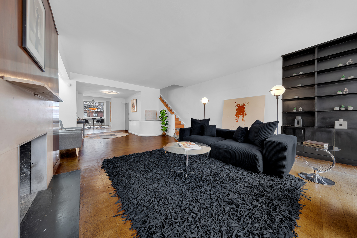 219 East 49th Street Manhattan, NY 10017 - Photo 3 of 19 a living room with furniture and a kitchen view