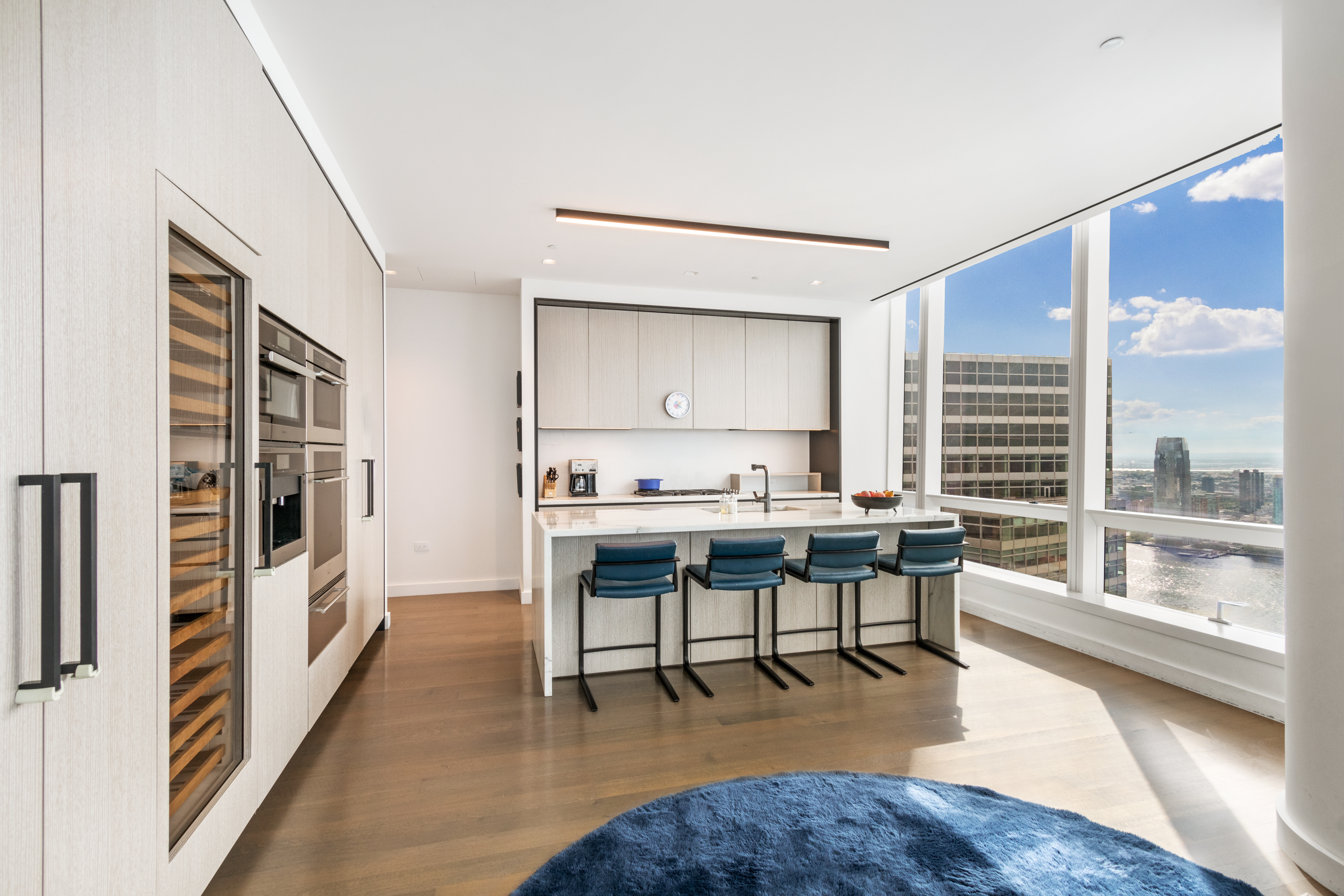 111 Murray Street, Unit 61W Manhattan, NY 10007 - Photo 10 of 35 a view of a livingroom with furniture window and wooden floor