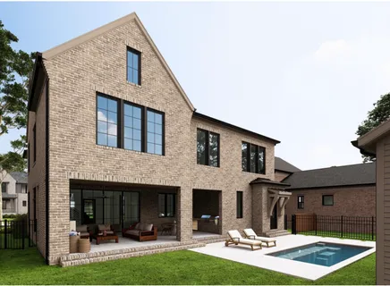 a front view of house with yard and outdoor seating