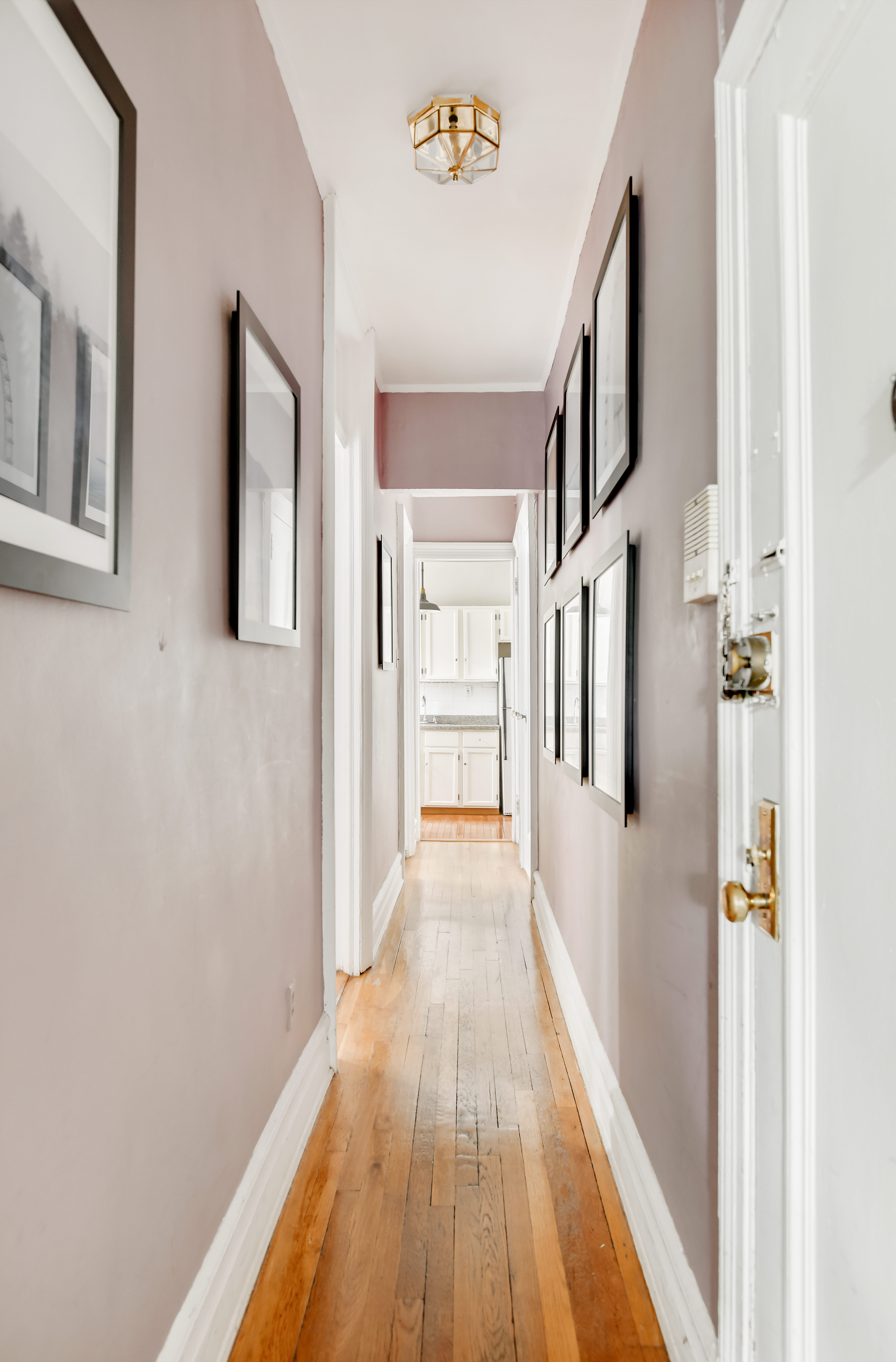 408 8th Avenue, Unit 3B Brooklyn, NY 11215 - Photo 5 of 5 a view of a hallway with wooden floor and staircase