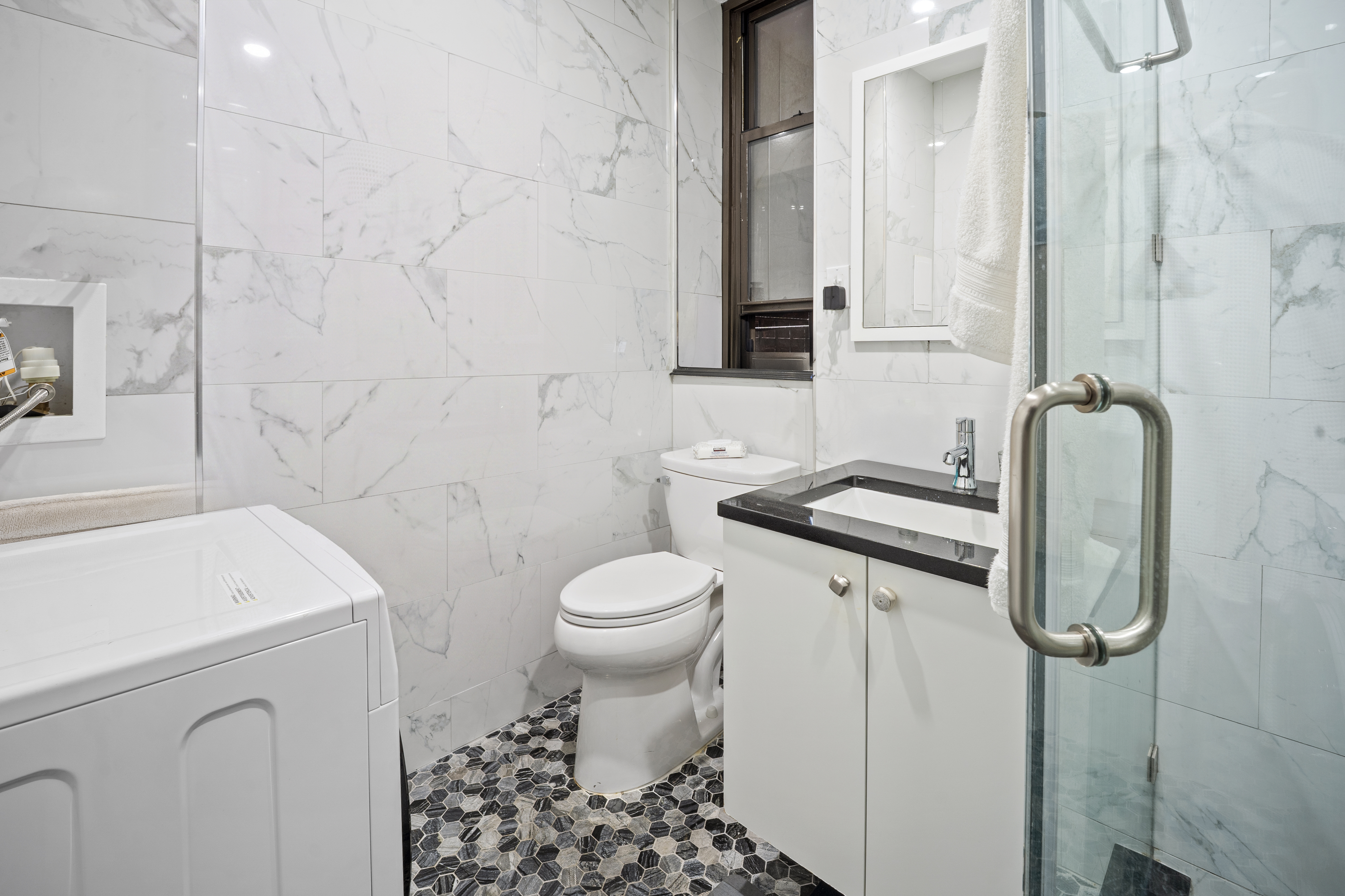 36 West 35th Street, Unit 2A Manhattan, NY 10001 - Photo 11 of 11 a bathroom with a sink toilet and shower