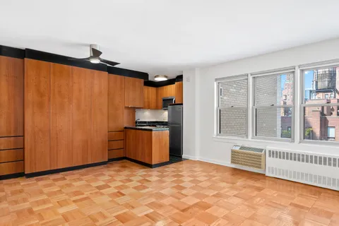a view of a kitchen with a dishwasher and a window