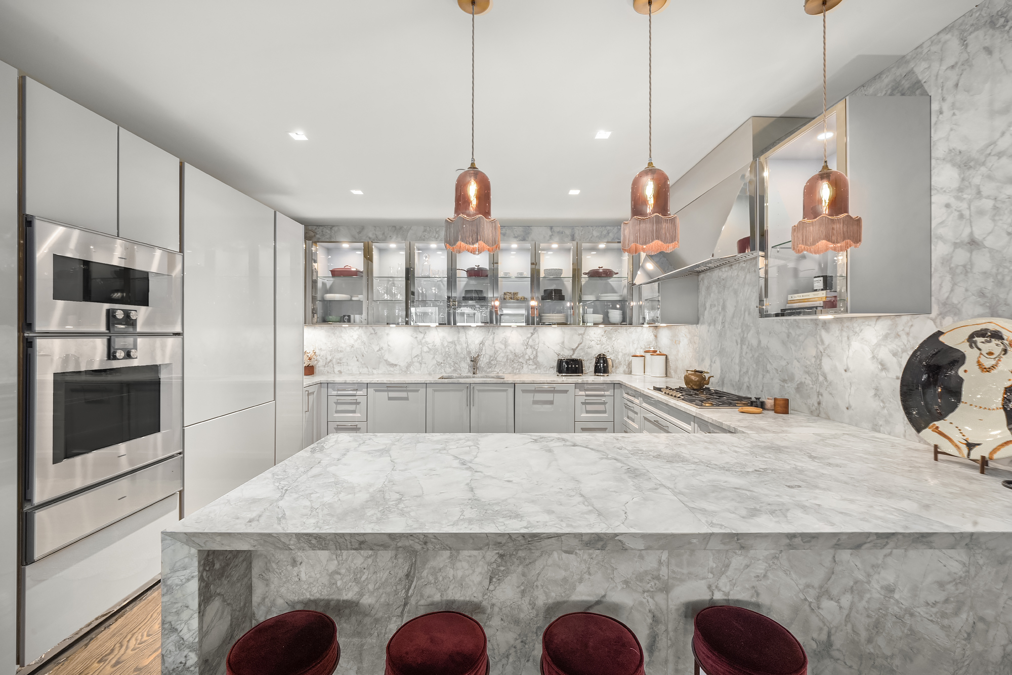14-16 Wooster Street, Unit 2 Manhattan, NY 10013 - Photo 11 of 22 a large kitchen with kitchen island granite countertop a sink a counter space stainless steel appliances and cabinets