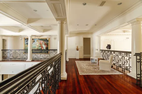 a view of a balcony dining table chairs and wooden floor