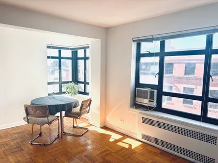 a workspace with furniture window and outside view