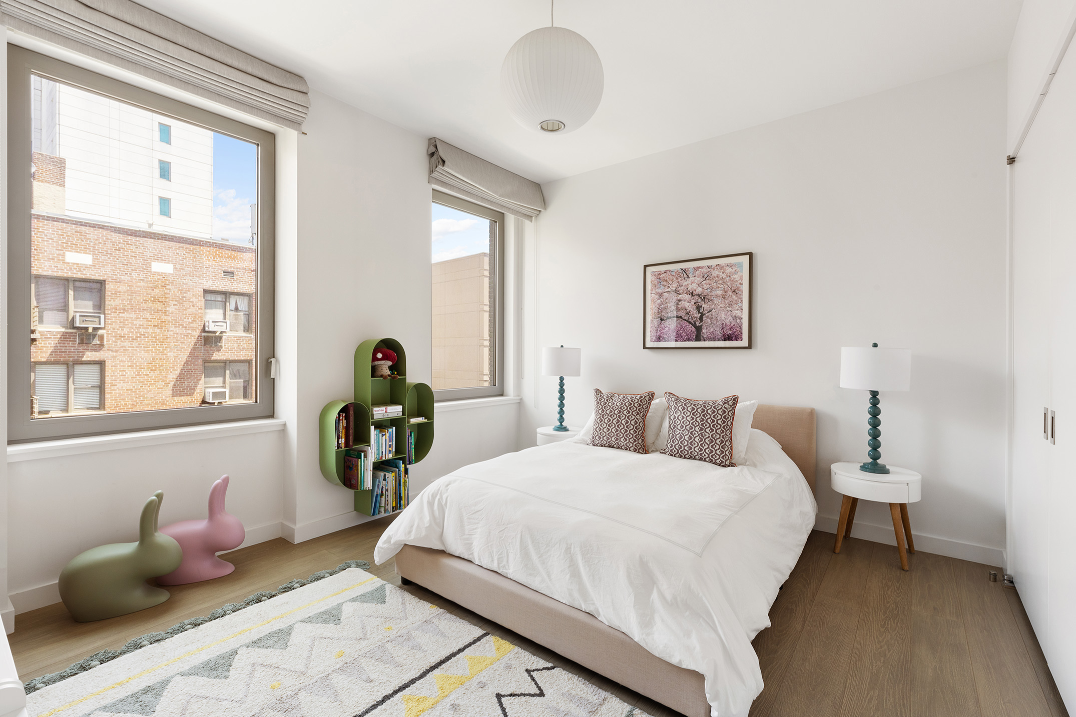 116 University Place, Unit 5 Manhattan, NY 10003 - Photo 16 of 19 a bedroom with bed and a large window