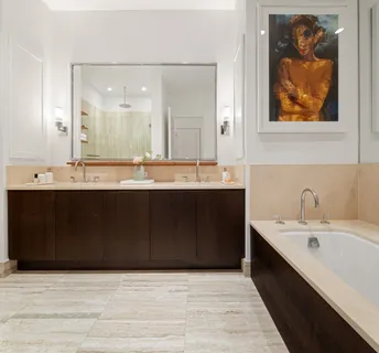 a bathroom with a sink double vanity and a mirror