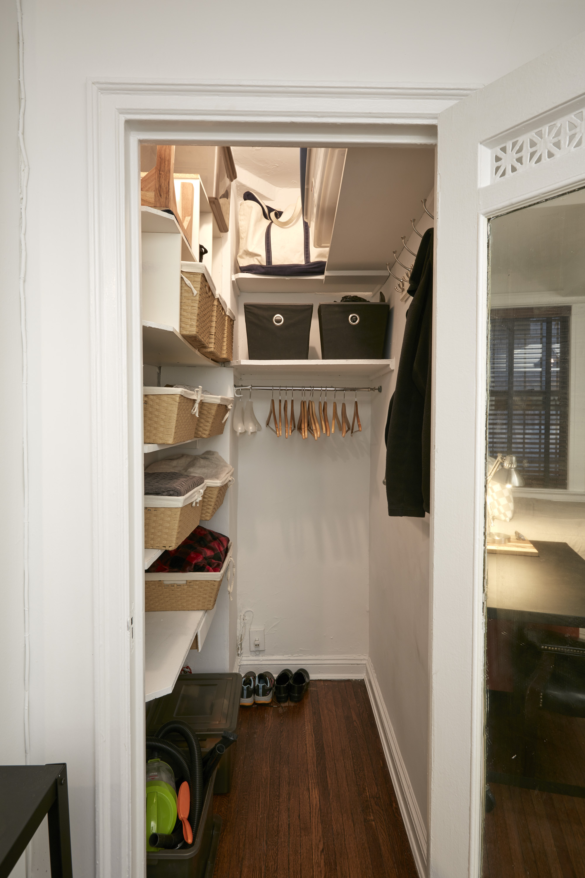 457 West 57th Street, Unit 108 Manhattan, NY 10019 - Photo 4 of 8 a view of walk in closet with clothes and shoes