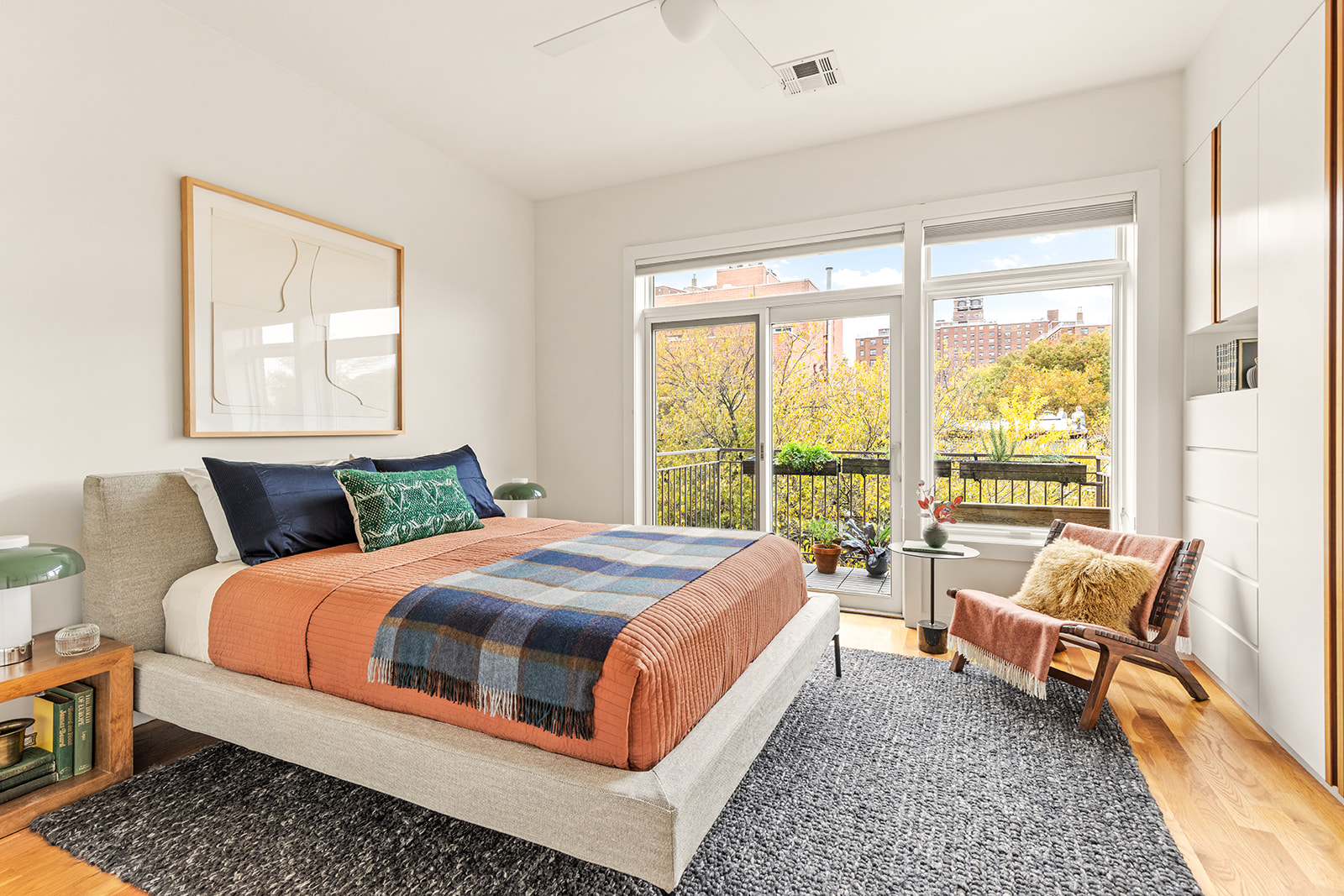323 Greene Avenue, Unit 4A Brooklyn, NY 11238 - Photo 7 of 14 a bedroom with a bed and large windows