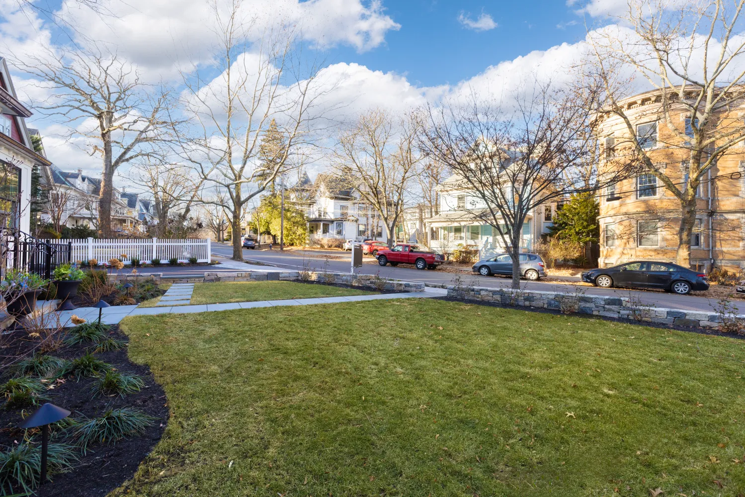 a view of yard with swimming pool and green space