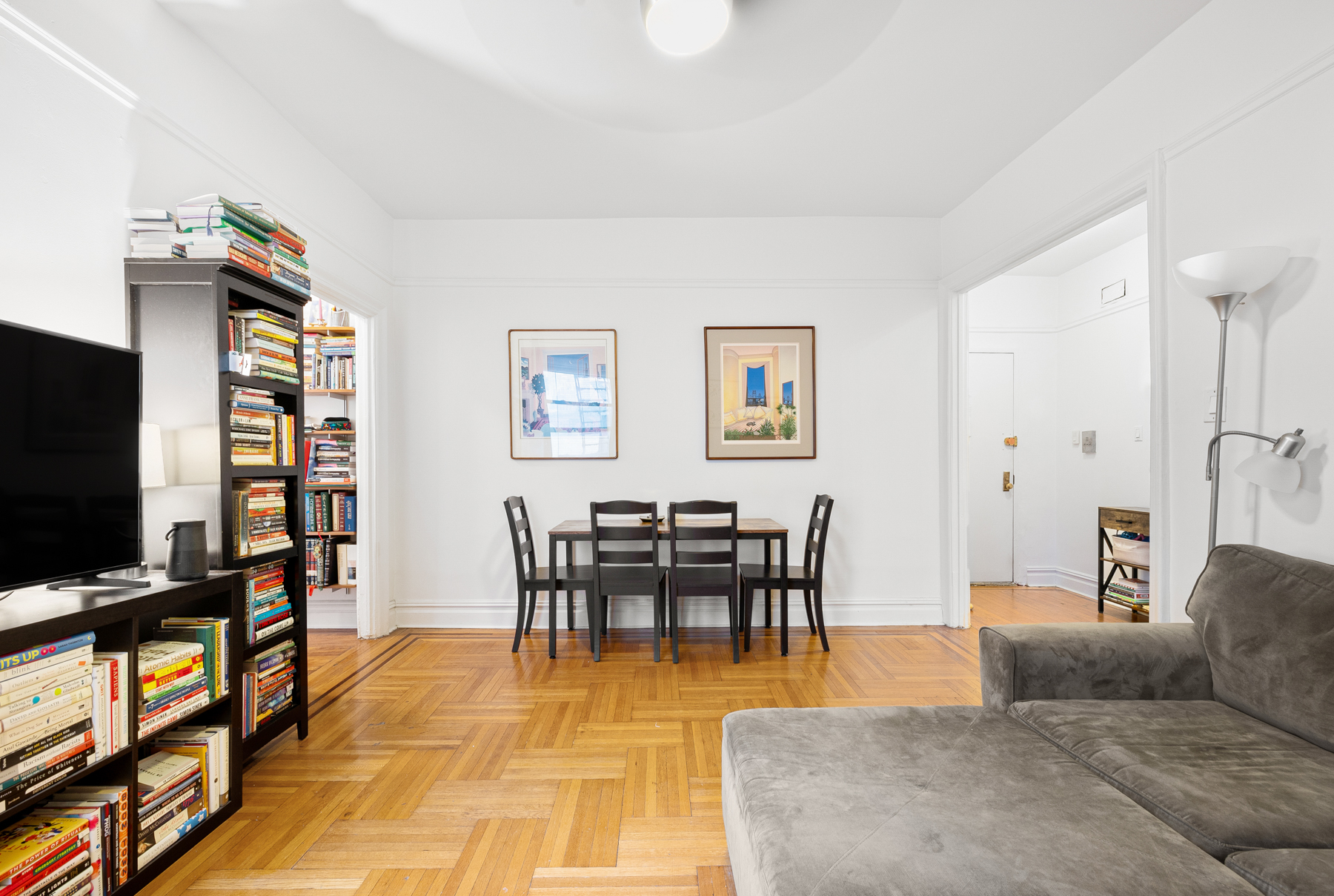 255 Eastern Parkway, Unit C5 Brooklyn, NY 11238 - Photo 2 of 9 a living room with furniture and a flat screen tv