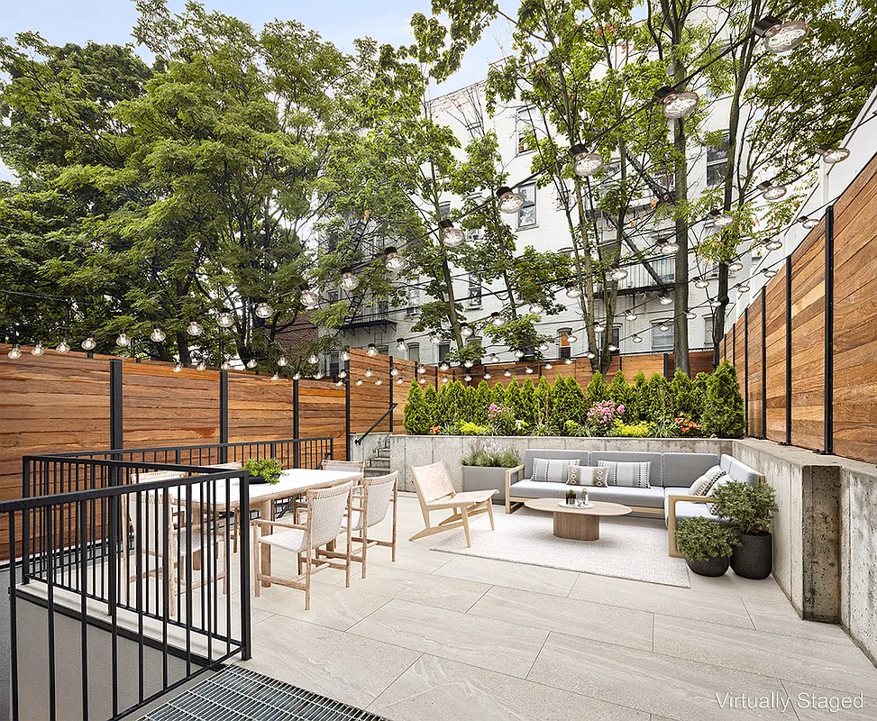 a view of a patio with table and chairs and potted plants