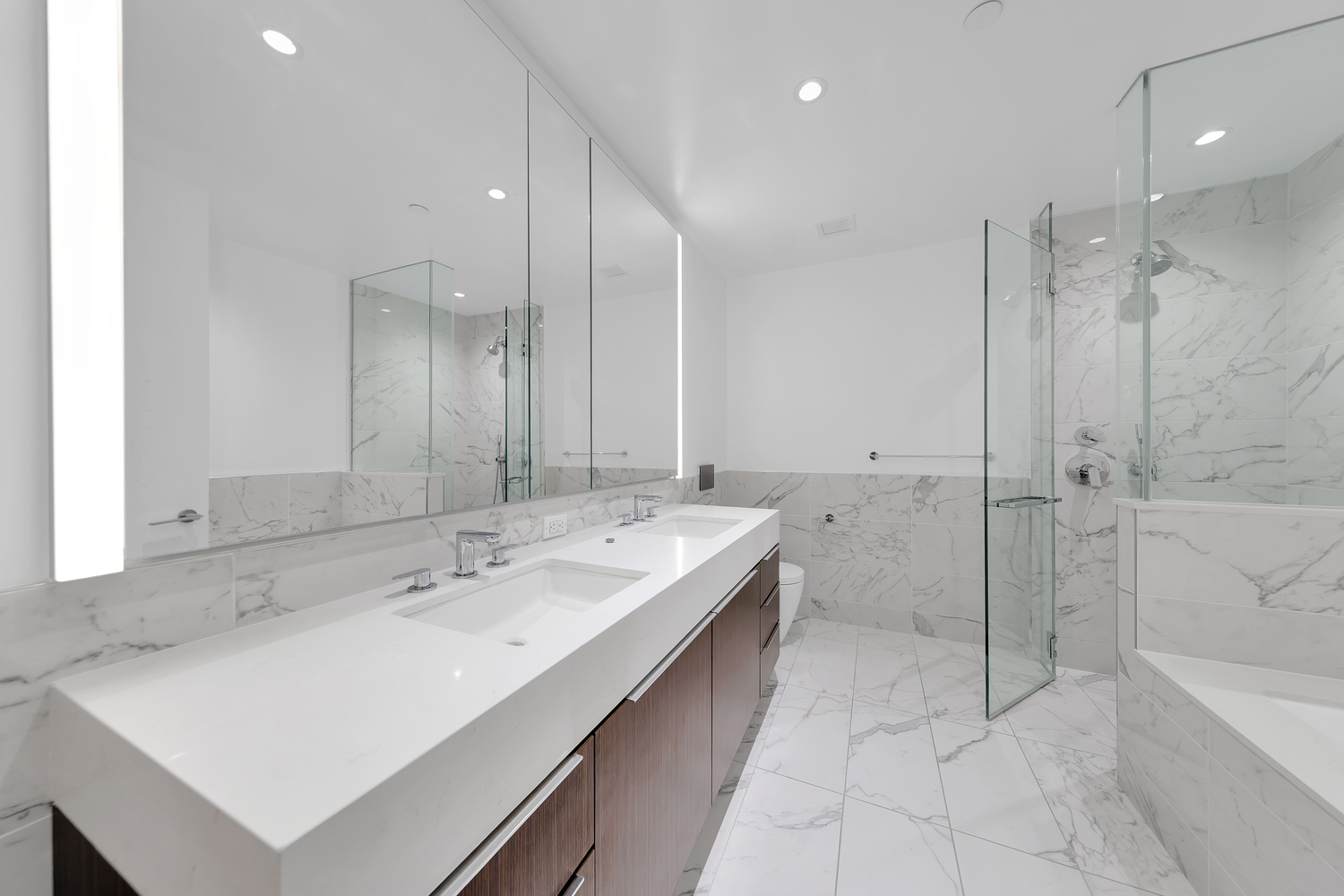 30 Riverside Boulevard, Unit 1414 Manhattan, NY 10069 - Photo 9 of 25 a bathroom with a sink a toilet and shower