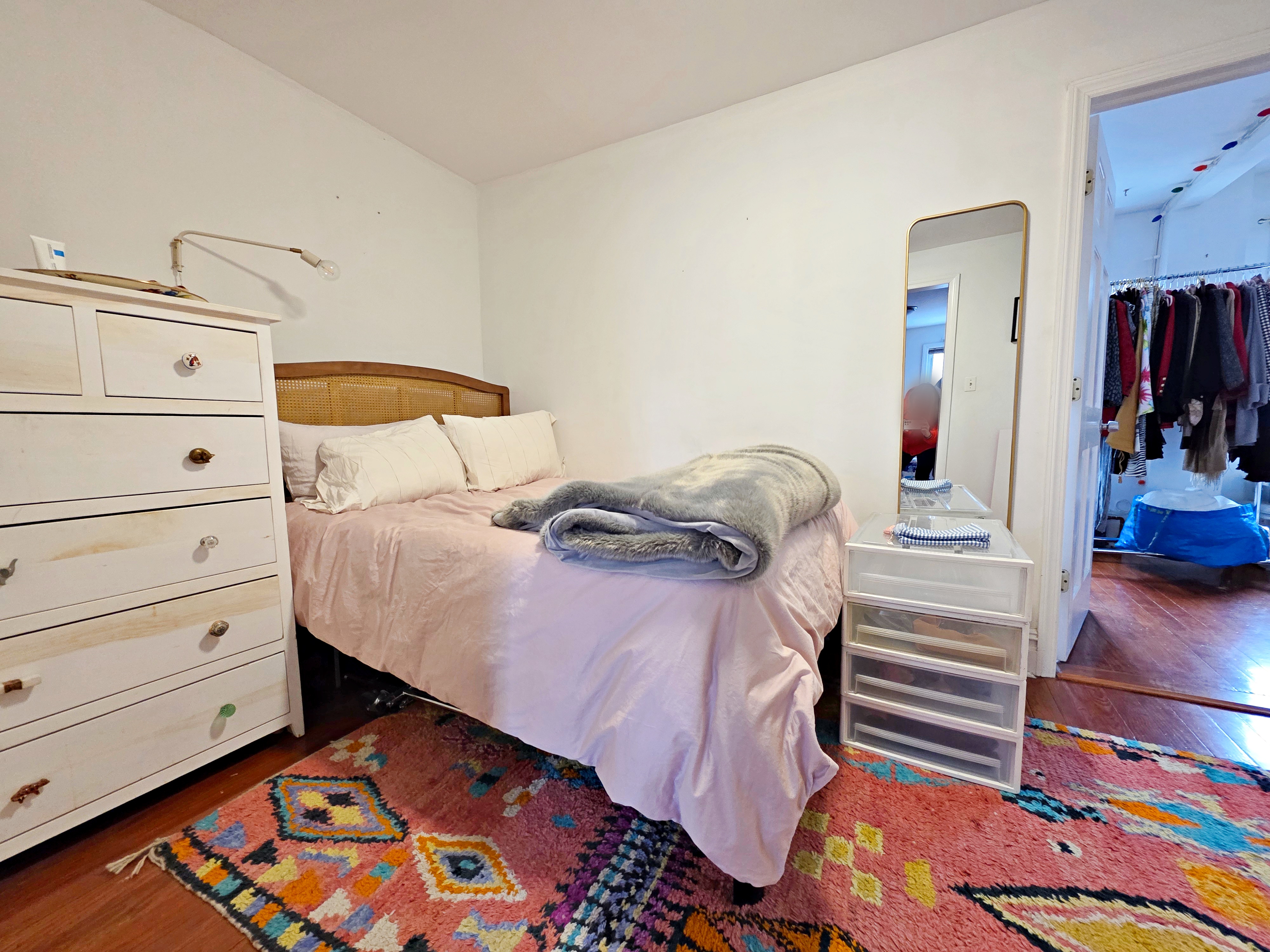 214 Devoe Street, Unit 2 Brooklyn, NY 11211 - Photo 4 of 8 a bedroom with a bed and a mirror
