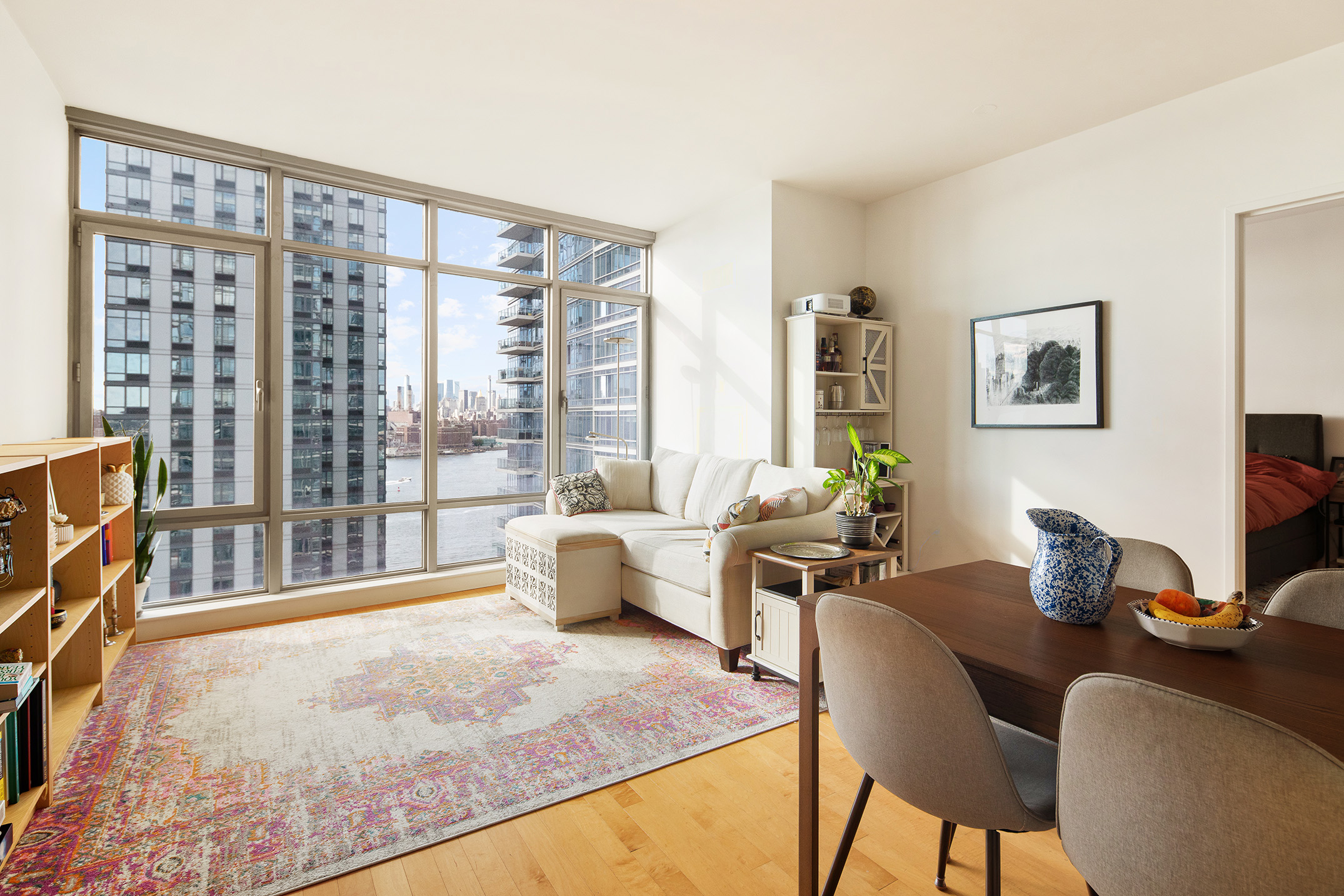 1 Northside Piers, Unit 18C Brooklyn, NY 11249 - Photo 2 of 12 a living room with furniture and a floor to ceiling window
