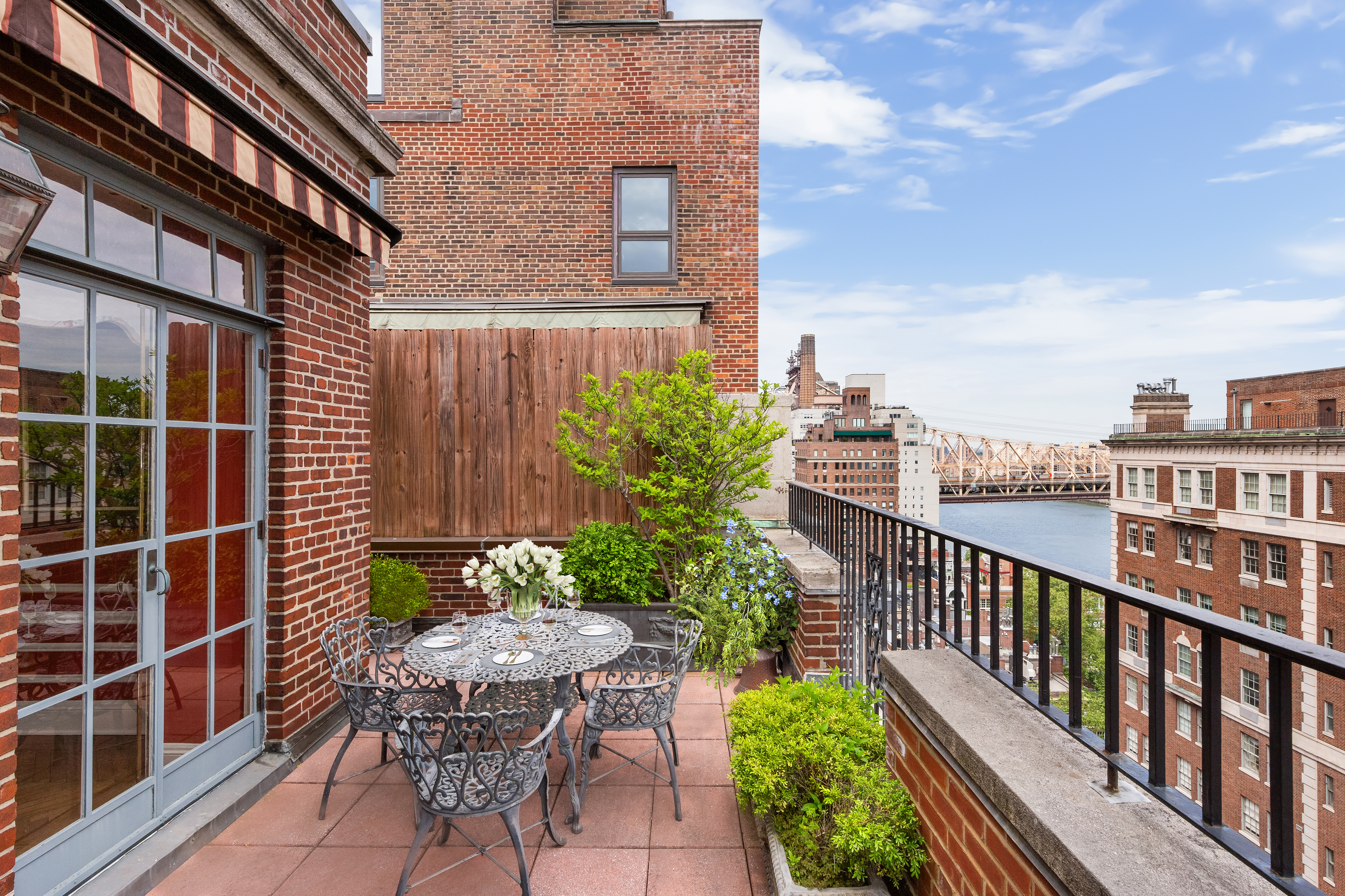 14 Sutton Place South, Unit PHA Manhattan, NY 10022 - Photo 5 of 22 a view of a chair and table in the balcony
