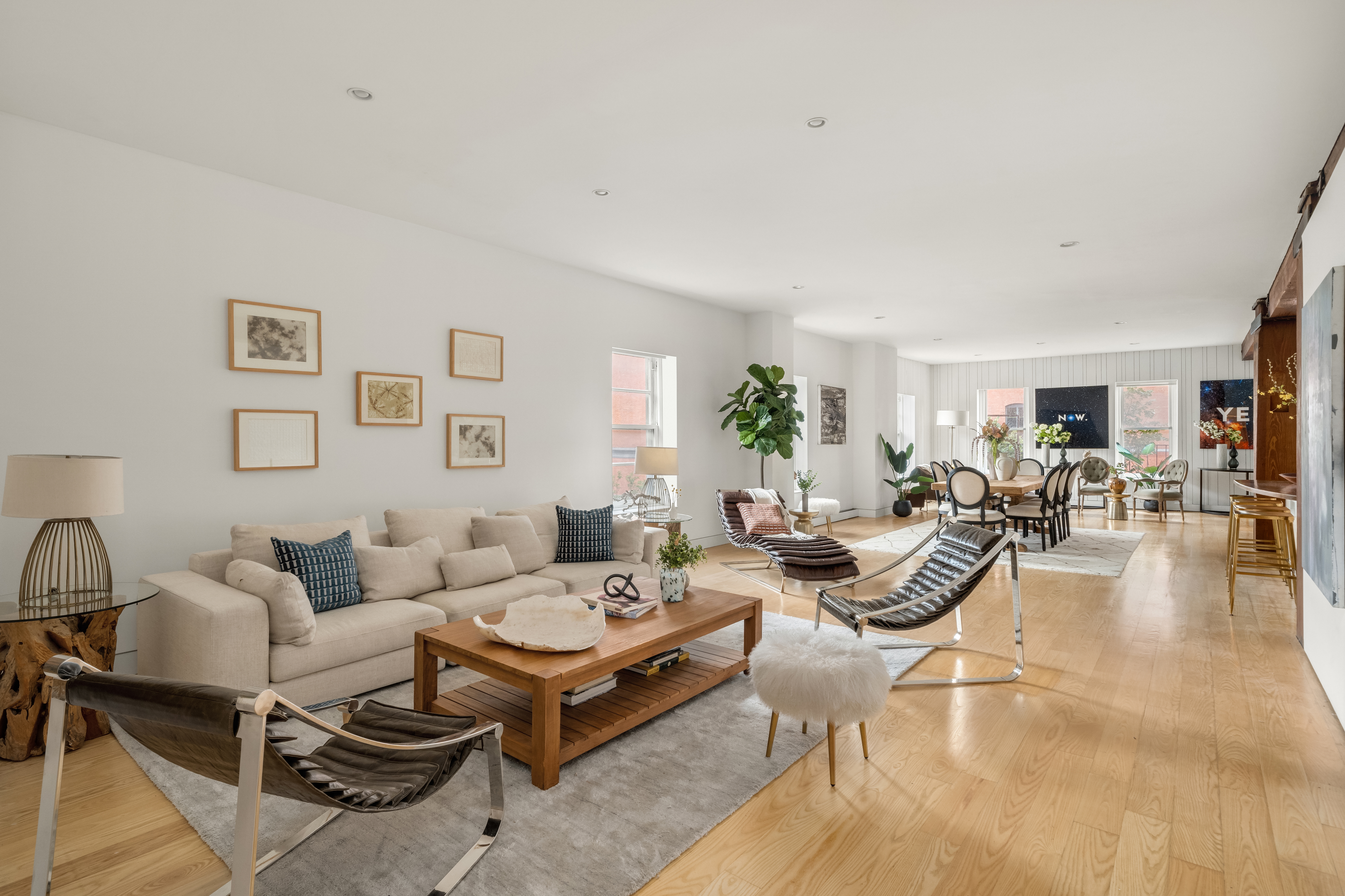 719 Greenwich Street, Unit 3S Manhattan, NY 10014 - Photo 7 of 21 a living room with furniture and wooden floor