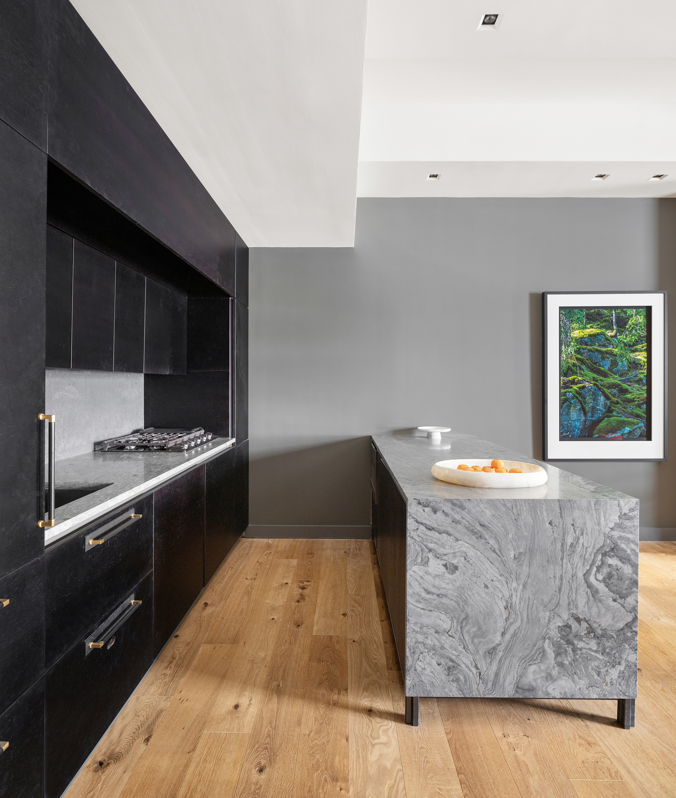 20 Pine Street, Unit 2408 Manhattan, NY 10005 - Photo 4 of 10 a kitchen with granite countertop a stove and a sink