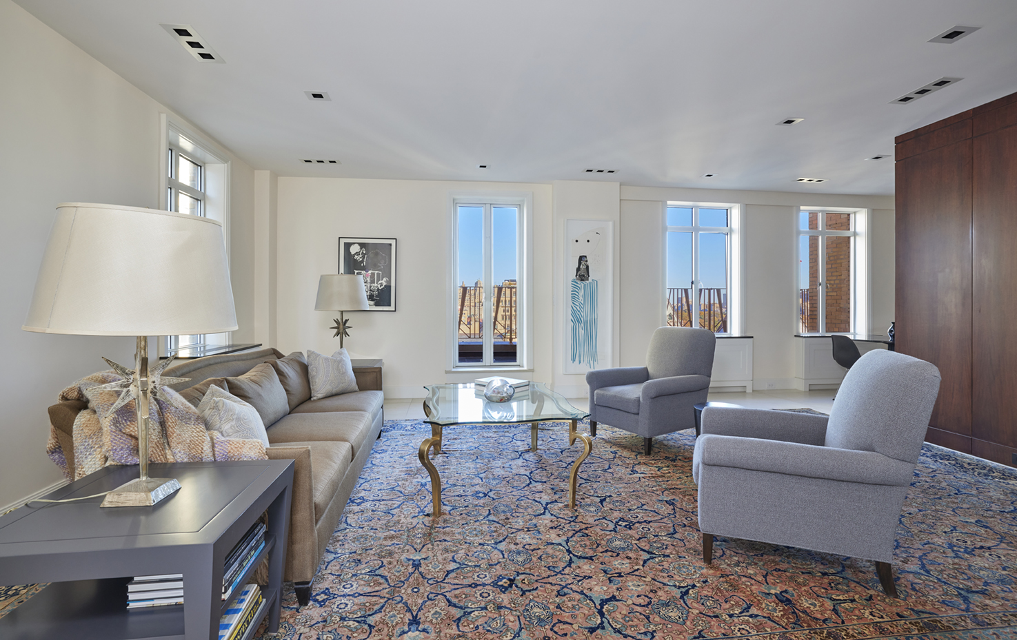 115 Central Park West, Unit 18JK Manhattan, NY 10023 - Photo 12 of 25 a living room with furniture and a lamp