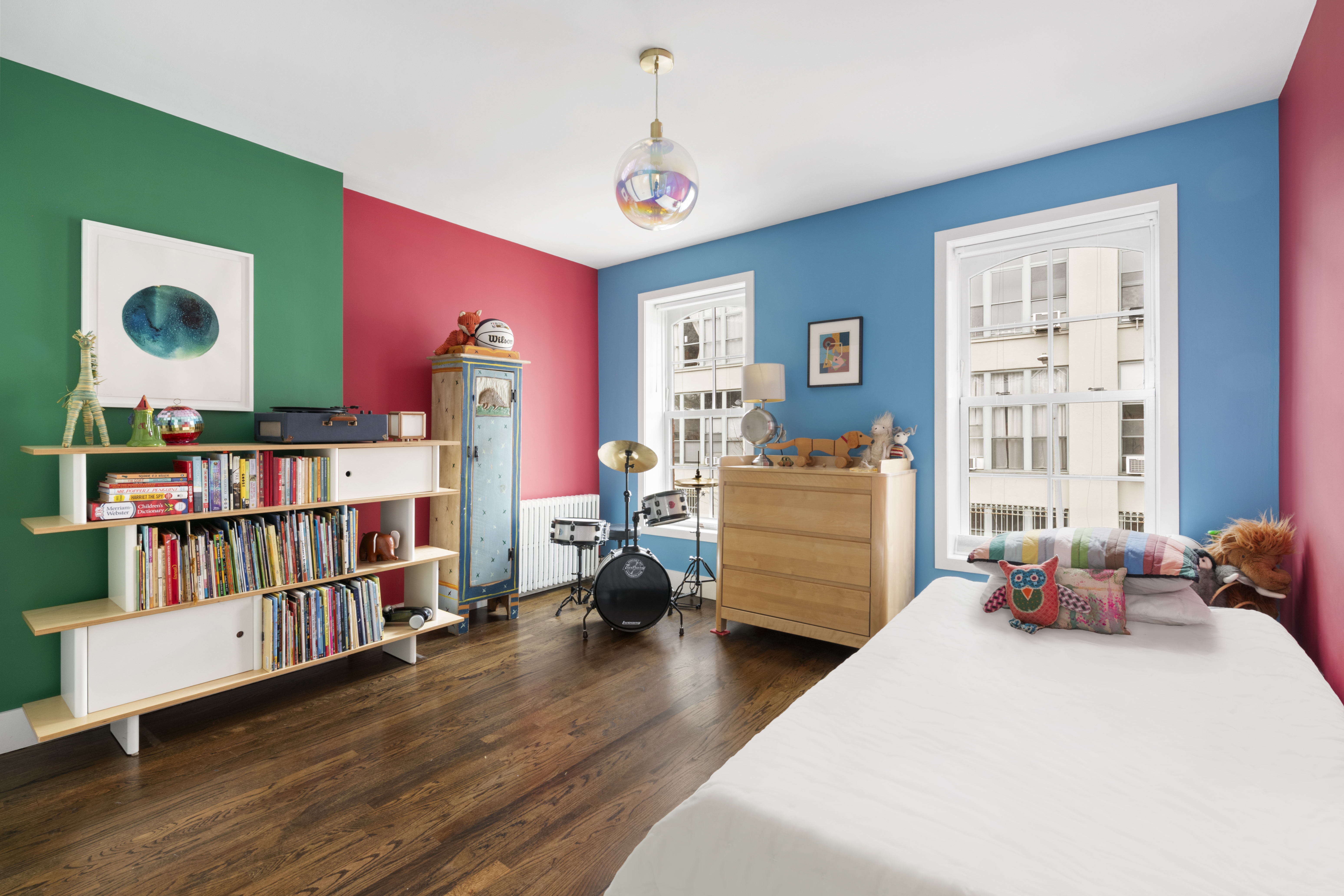 203 Huntington Street Brooklyn, NY 11231 - Photo 11 of 16 a bedroom with furniture and a book shelf