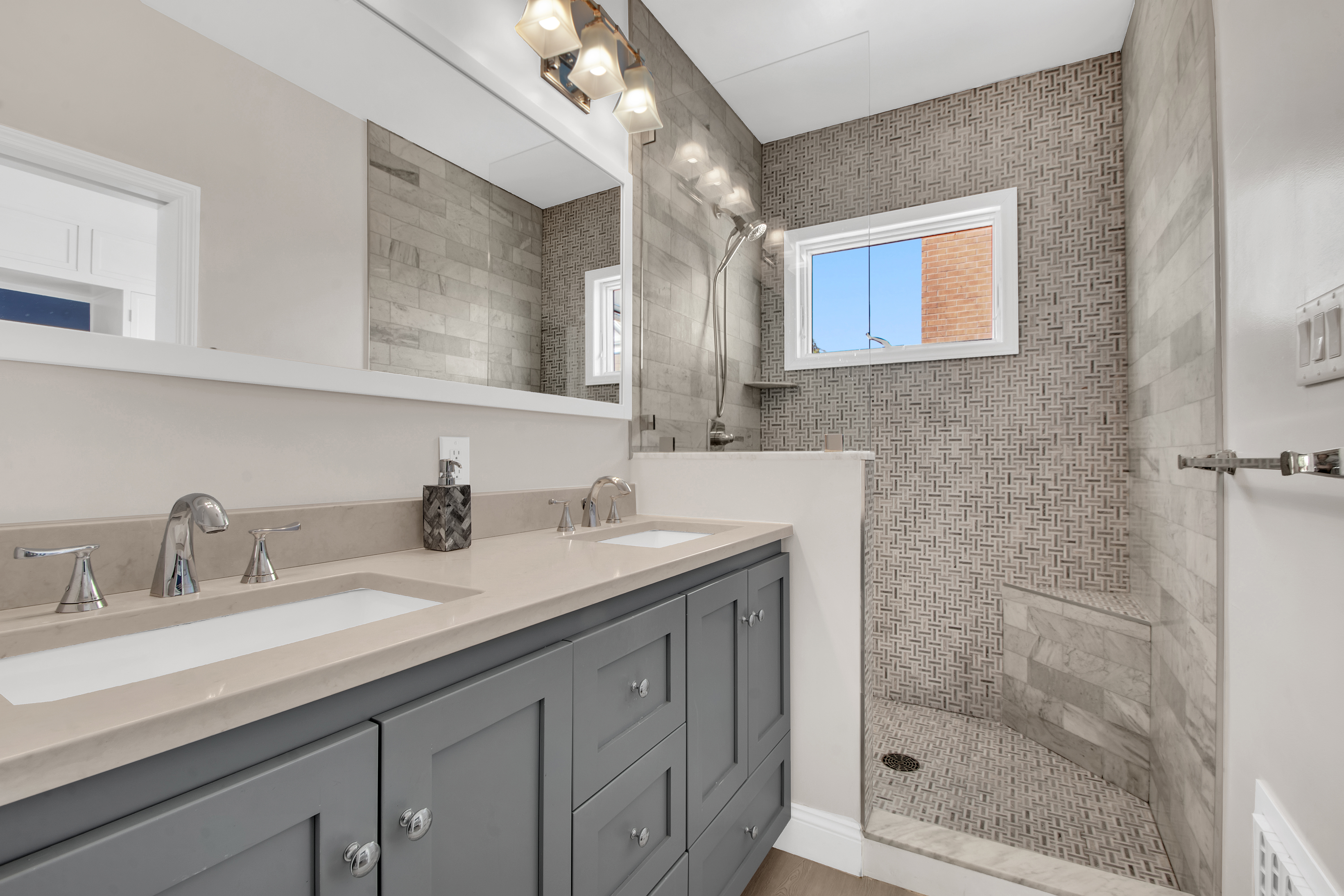 594 6th Avenue, Unit 3 Brooklyn, NY 11215 - Photo 8 of 11 a bathroom with double sink and a mirror