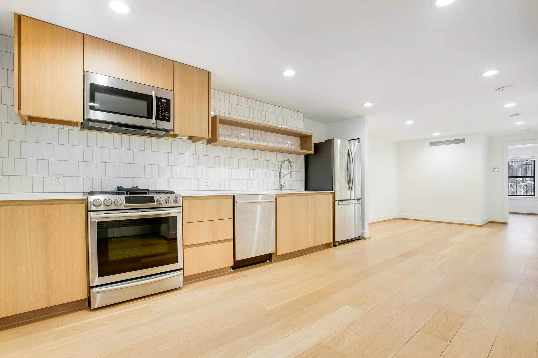 14 Hampton Place Brooklyn, NY 11213 - Photo 3 of 12 a kitchen with stainless steel appliances granite countertop a stove and a microwave