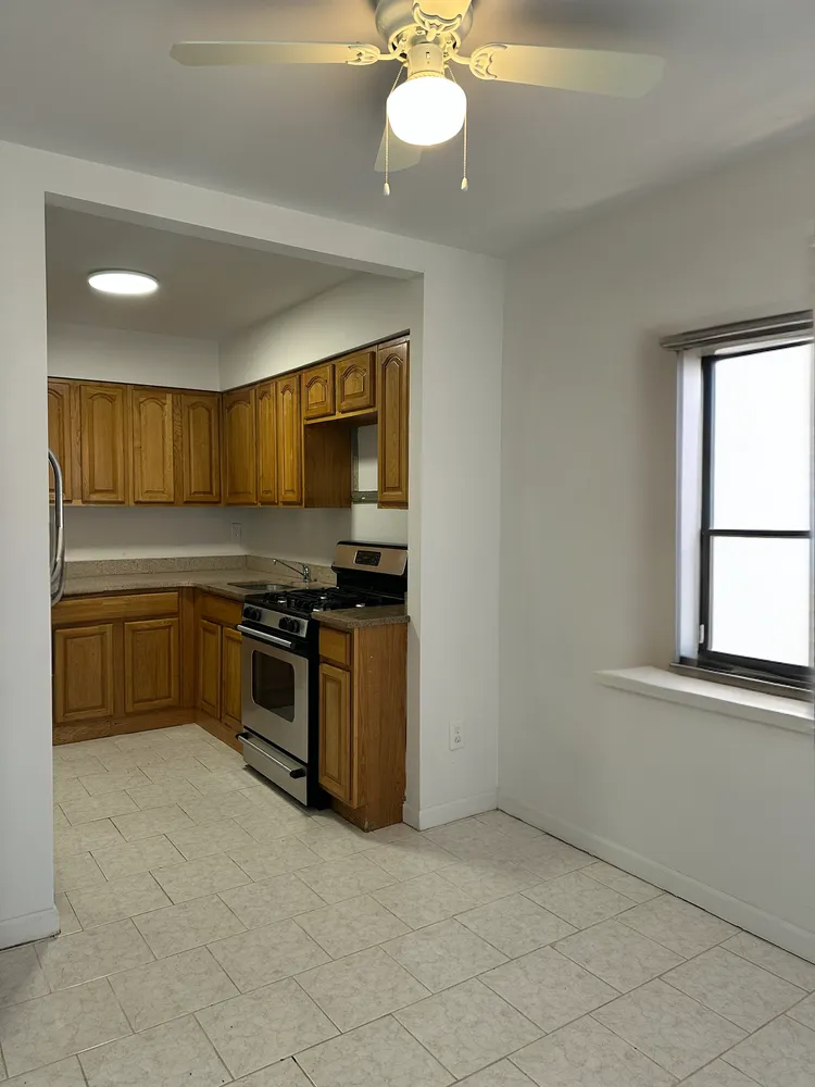 a kitchen with a sink cabinets and stainless steel appliances