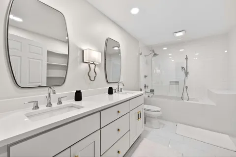 a bathroom with a double vanity sink mirror double and a