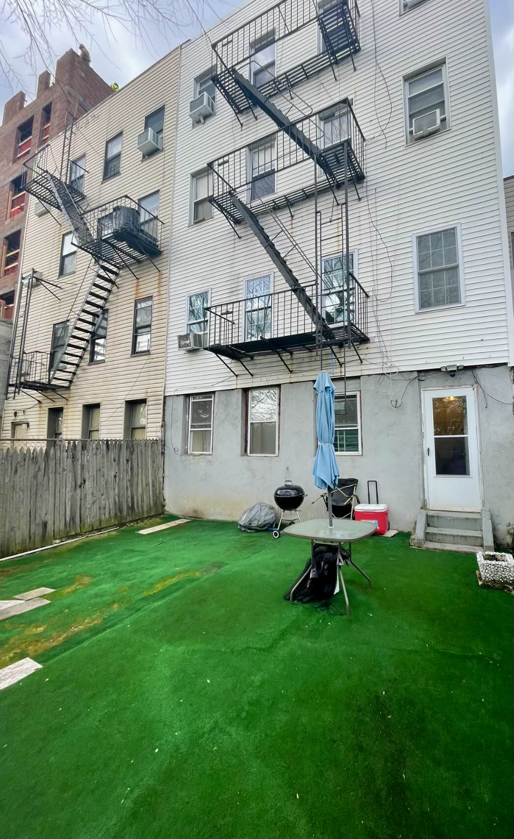 3194 Webster Avenue Bronx, NY 10467 - Photo 5 of 23 a backyard of a house with table and chairs