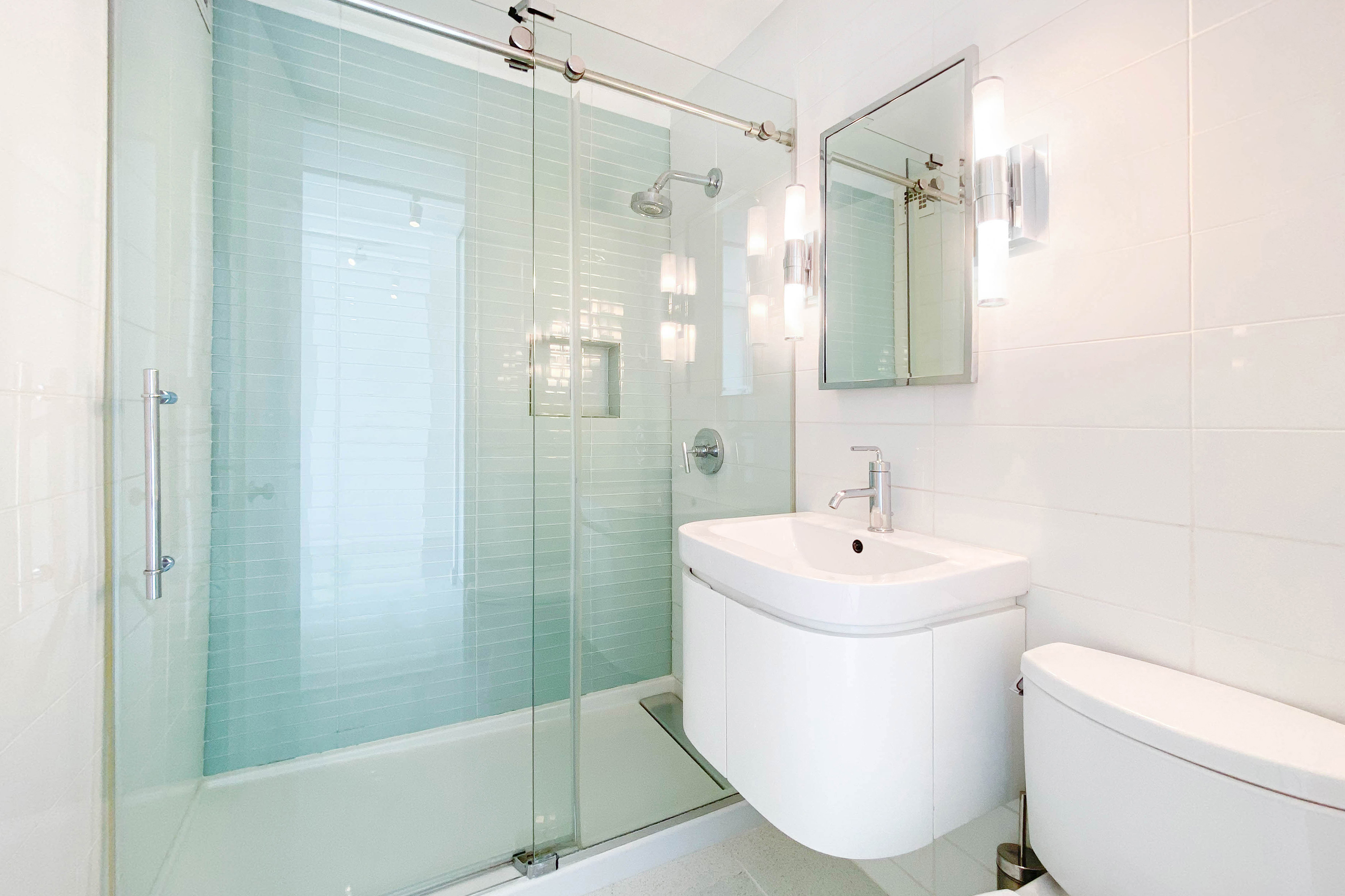 333 East 30th Street, Unit 12H Manhattan, NY 10016 - Photo 6 of 15 a bathroom with a sink a toilet and shower