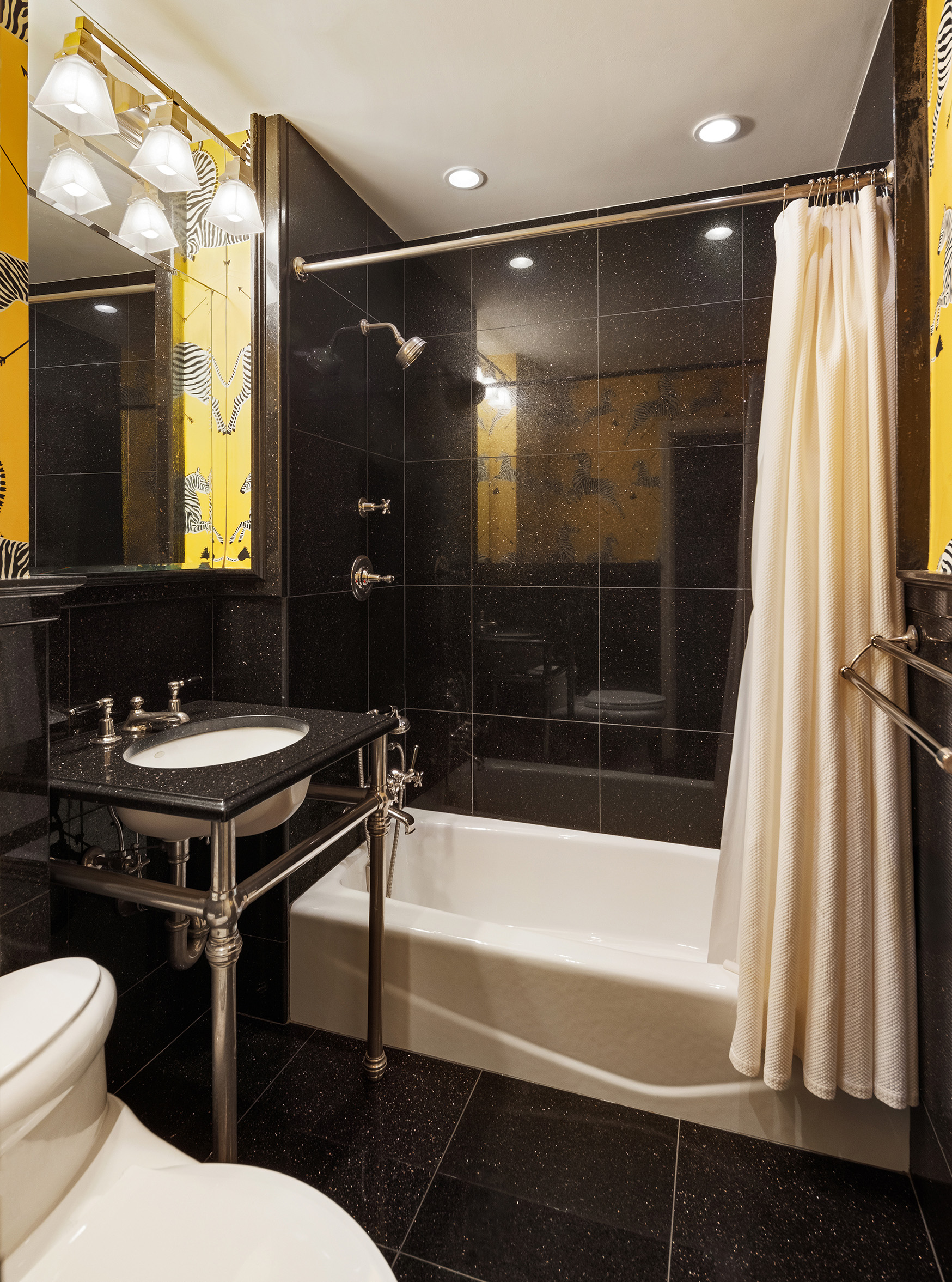 49 East 86th Street, Unit 3A Manhattan, NY 10028 - Photo 9 of 14 a bathroom with a sink and a mirror