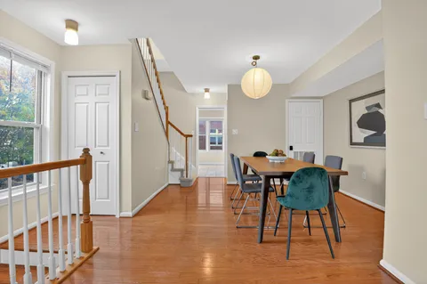 a view of a dining room with furniture window and wooden floor