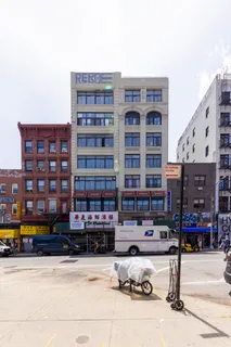 a front view of a building with street view