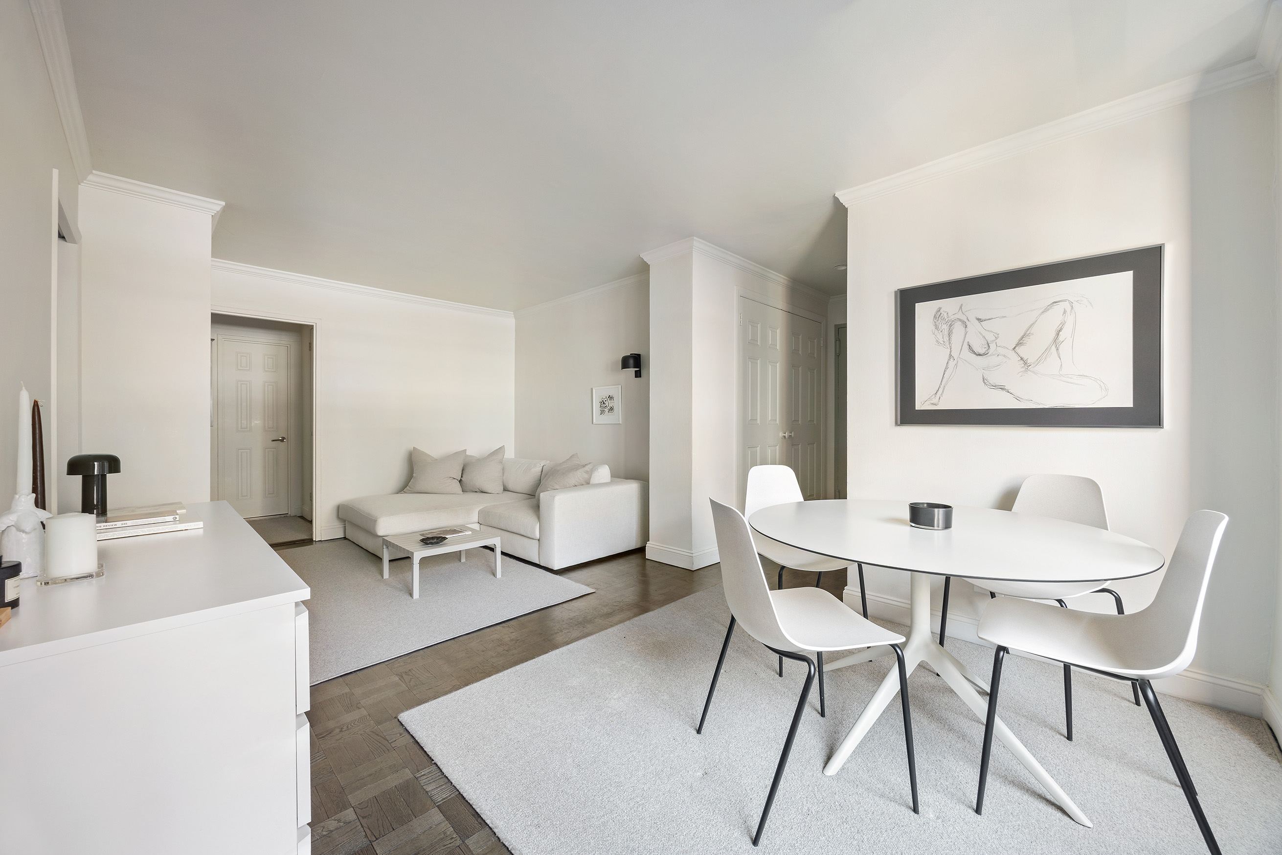 123 East 75th Street, Unit 6B Manhattan, NY 10021 - Photo 3 of 13 a living room with furniture and a table