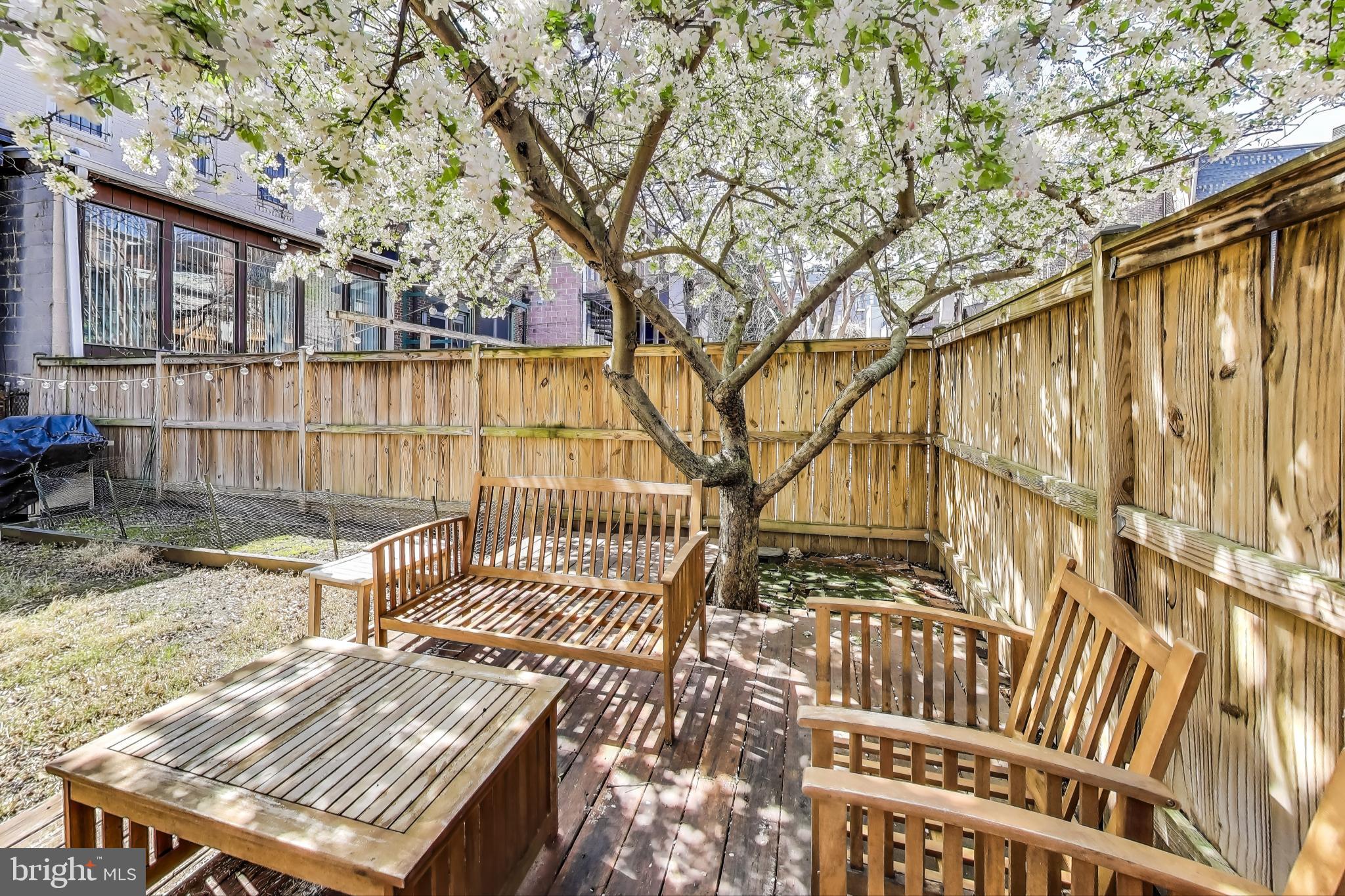1317 Corcoran Street Northwest Washington, DC 20009 - Photo 31 of 47 a view of a balcony with wooden floor and fence