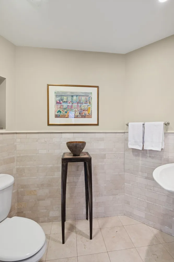 a bathroom with a toilet and a sink