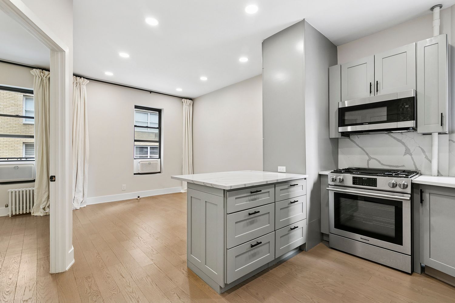 a kitchen with stainless steel appliances granite countertop a stove and a sink