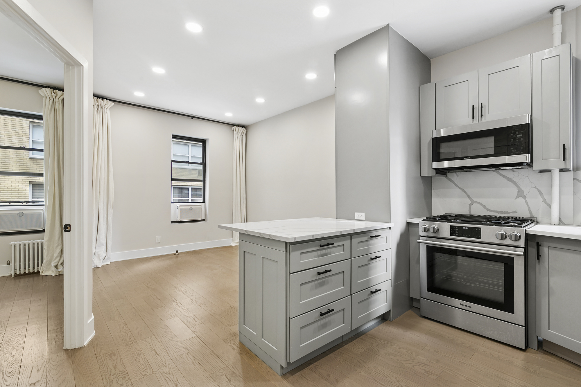 a kitchen with stainless steel appliances granite countertop a stove and a sink