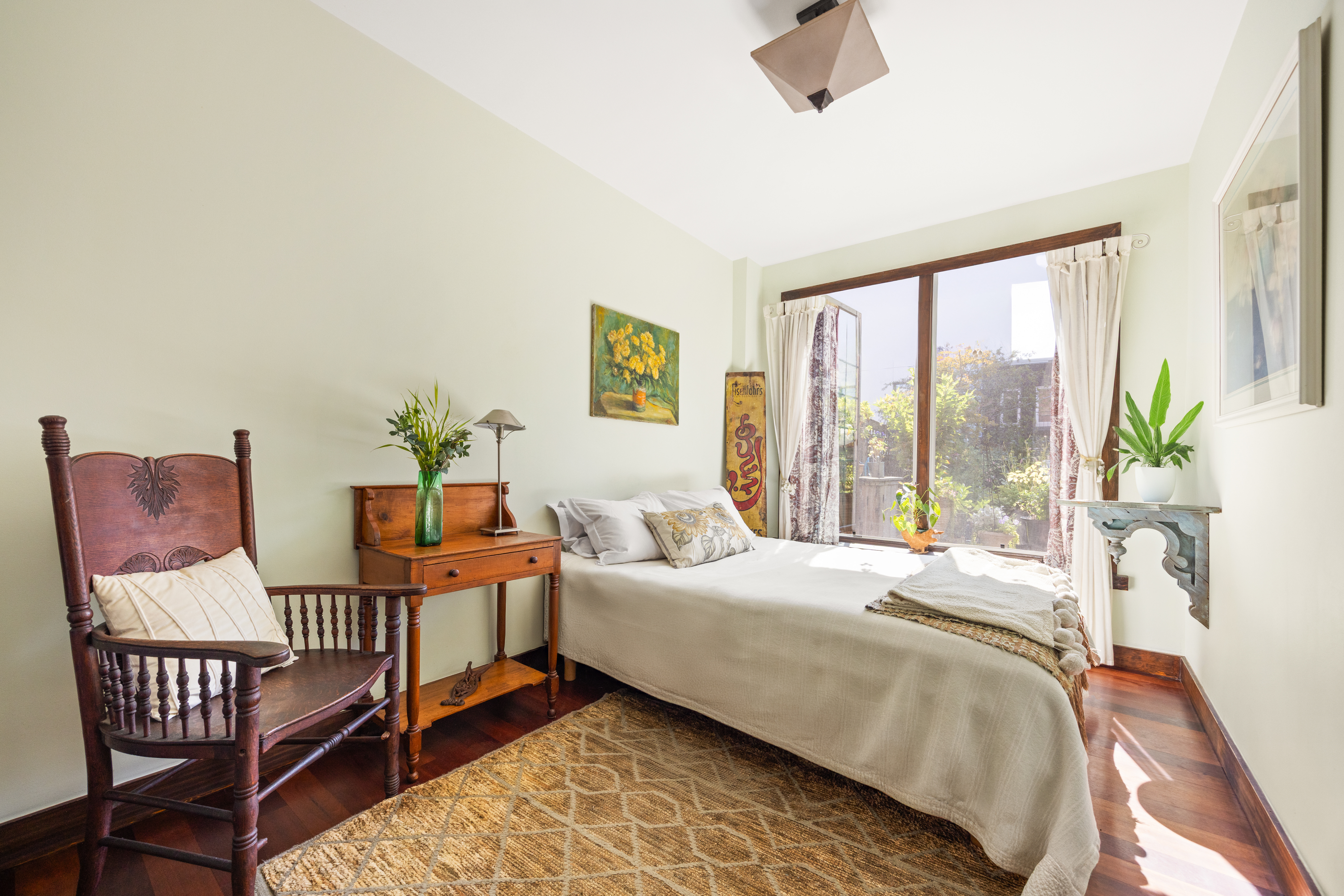 607 Manhattan Avenue, Unit 2 Brooklyn, NY 11222 - Photo 6 of 14 a bedroom with a bed and wooden floor