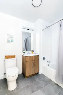 a bathroom with a toilet a sink and a bathtub