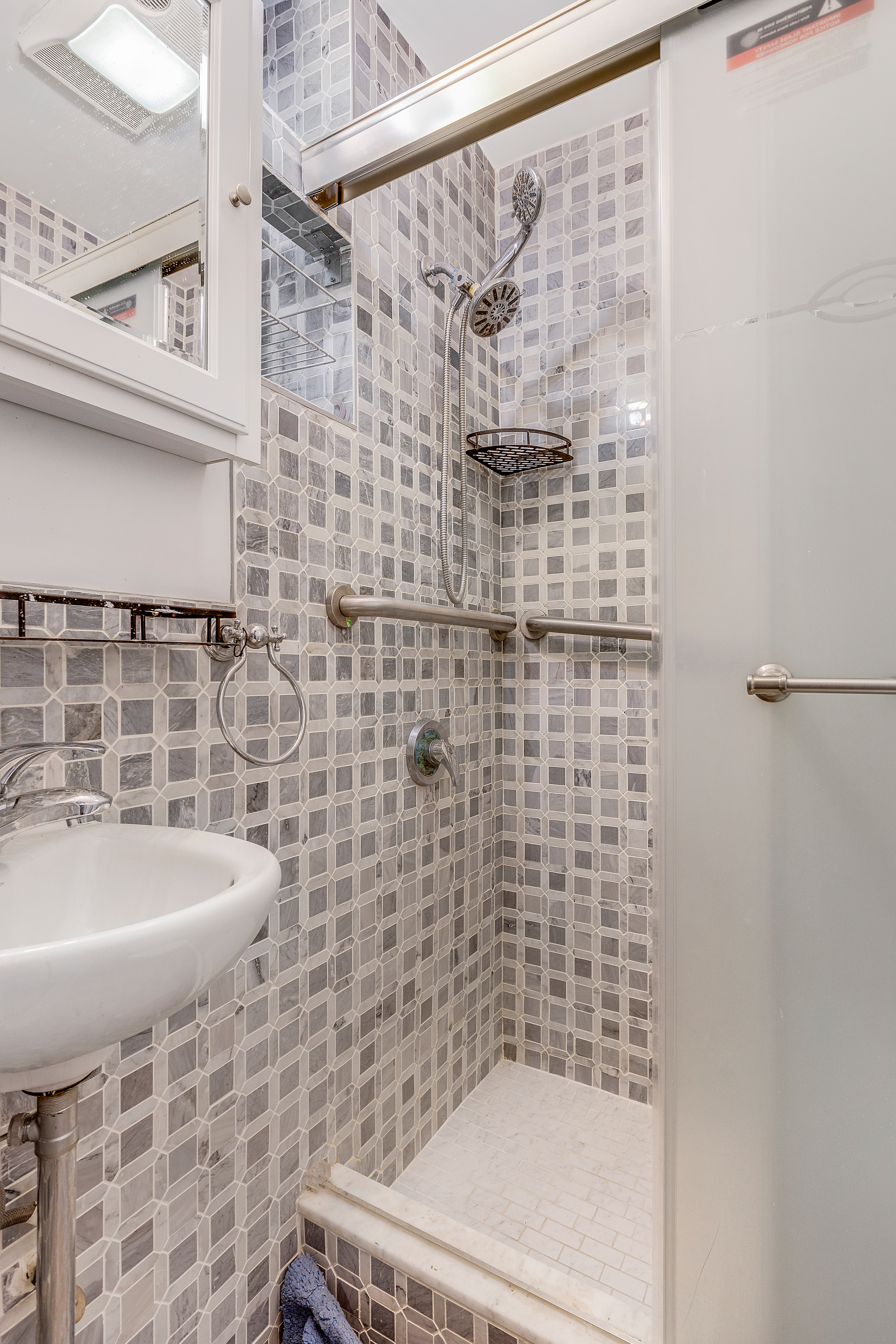 639 President Street, Unit 1L Brooklyn, NY 11215 - Photo 9 of 12 a bathroom with a sink a bathtub and shower