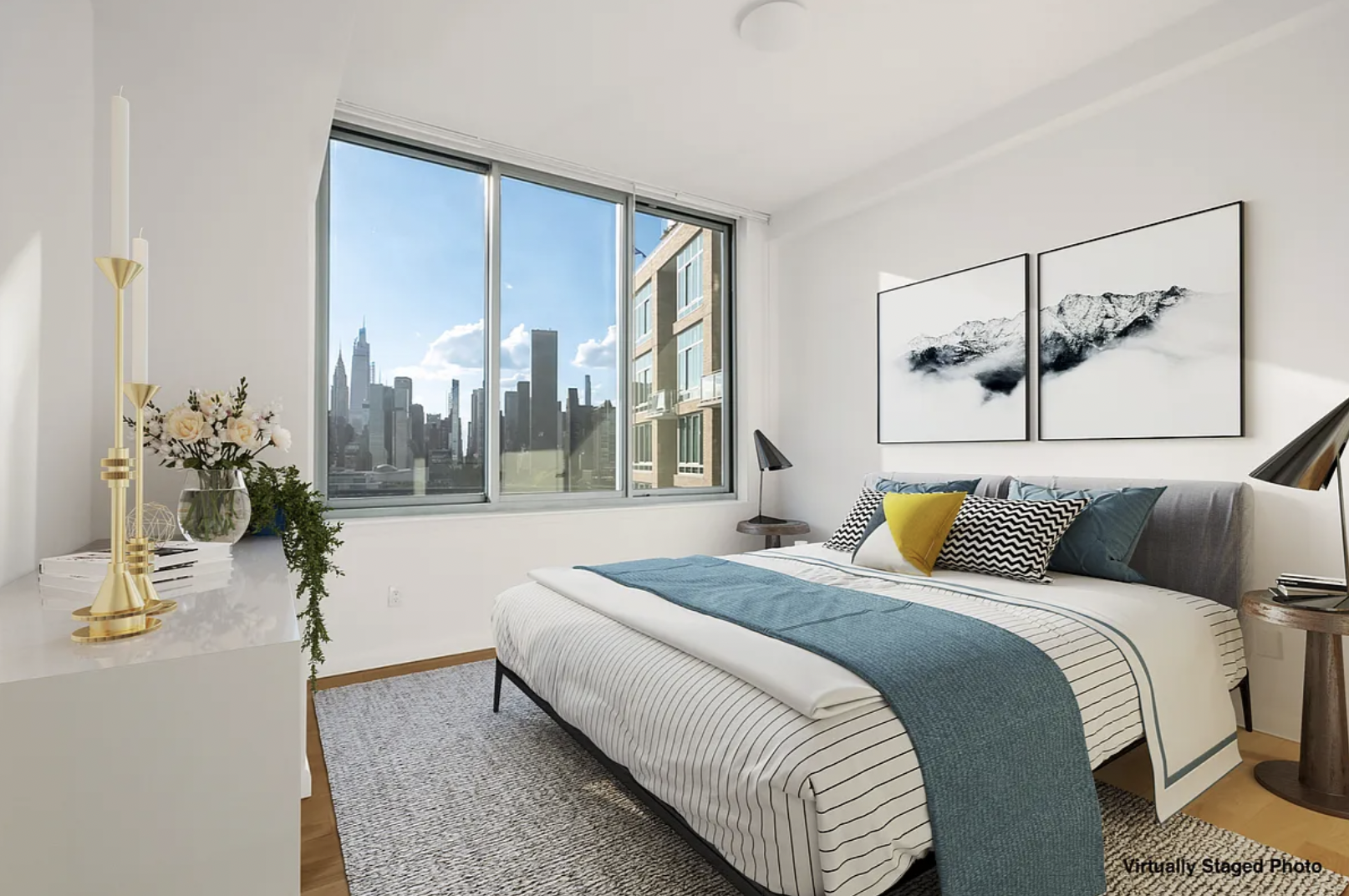 46-30 Center Boulevard, Unit 1209 Queens, NY 11109 - Photo 3 of 26 a bedroom with a large bed and a potted plant