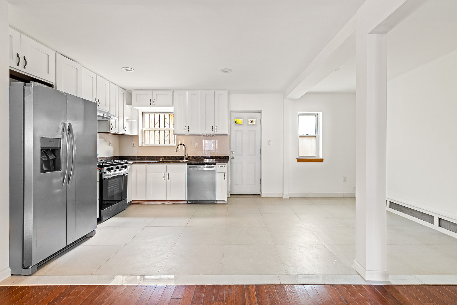 1644 Atlantic Avenue Brooklyn, NY 11213 - Photo 5 of 17 a kitchen with stainless steel appliances a refrigerator sink and cabinets
