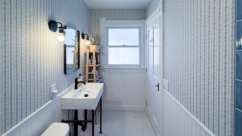 a bathroom with a sink vanity and a mirror